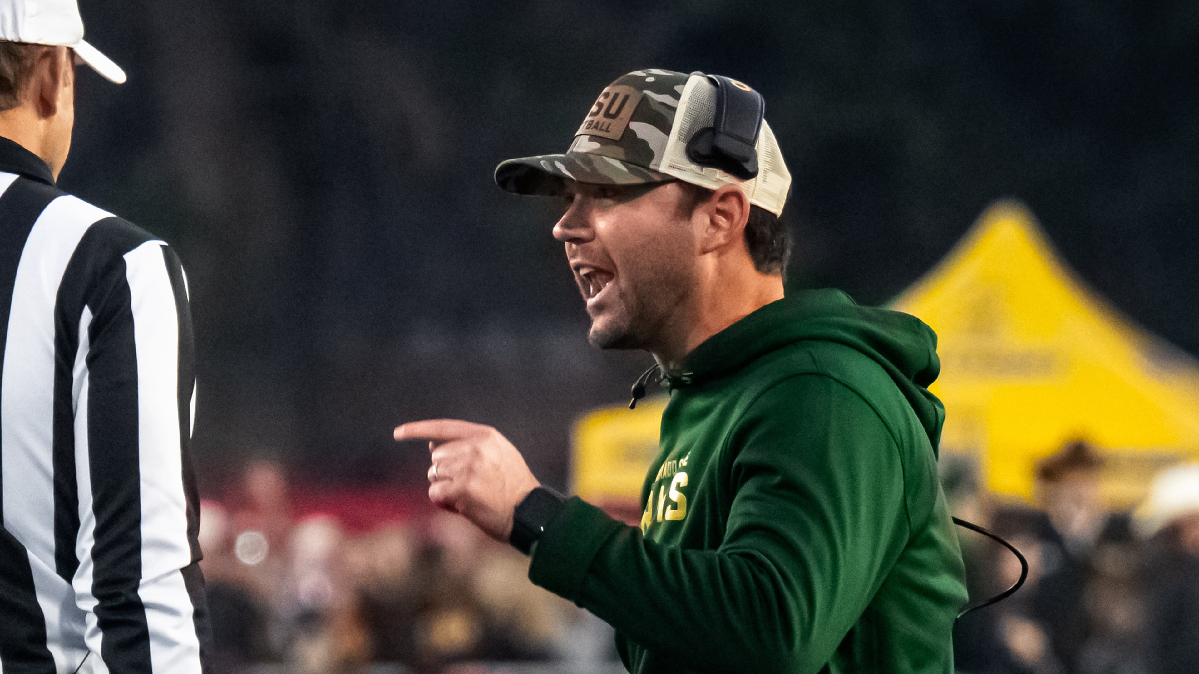 FILE - Colorado State interim head coach Tyson Summers speaks to the officials during an NCAA college football game against Wyoming on Saturday, Oct. 25, 2025, in Laramie, Wyo. (Milo Gladstein /The Wyoming Tribune Eagle via AP)/The Wyoming Tribune Eagle via AP, File)