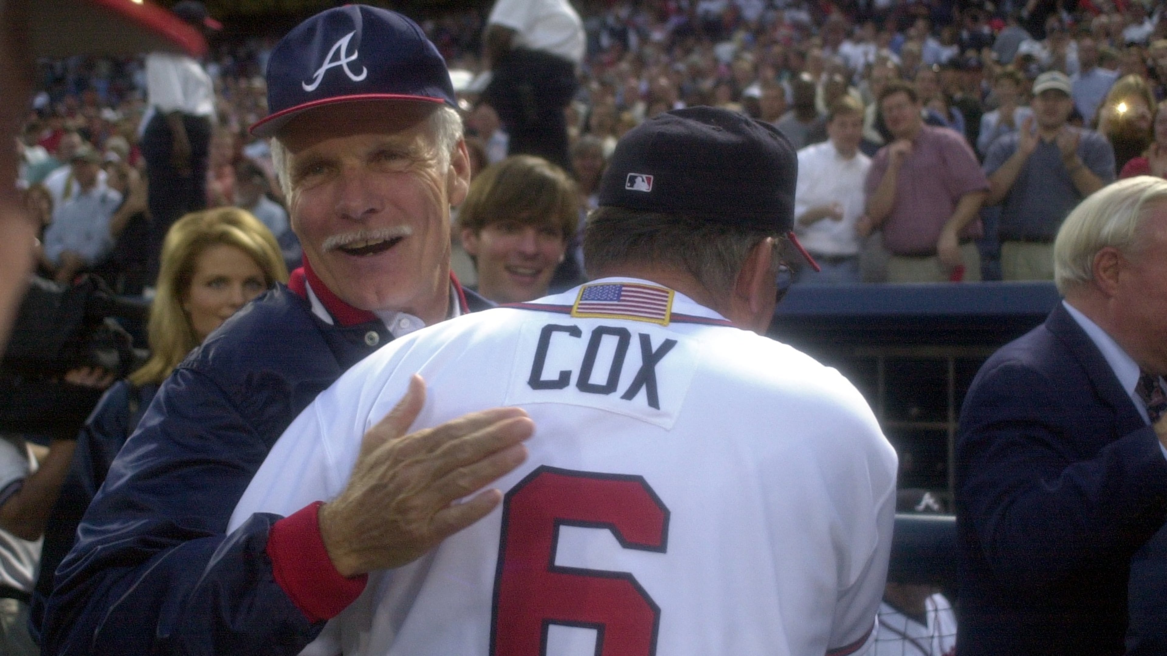 Longtime Braves owner Ted Turner (back) congratulates manager Bobby Cox on a win in the 2001 National League Division Series. (Marlene Karas/AJC 2001)