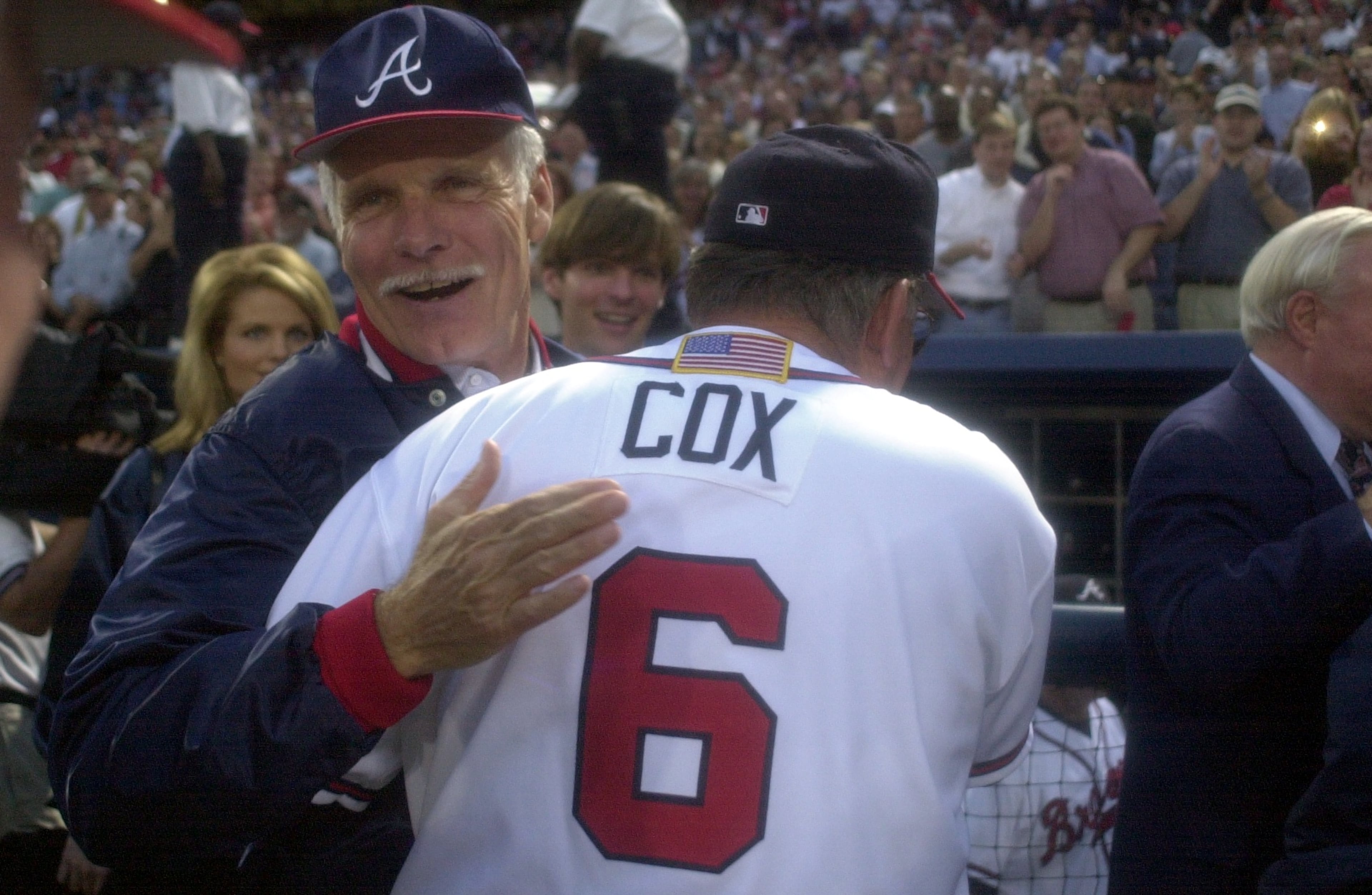 Longtime Braves owner Ted Turner congratulates manager Bobby Cox on his team's win following the Braves 6-2 win versus the Houston Astros in game 3 of the division series on Friday, 10/12/01. The Braves go to the National League Championship Series next week. (Marlene Karas/AJC File)