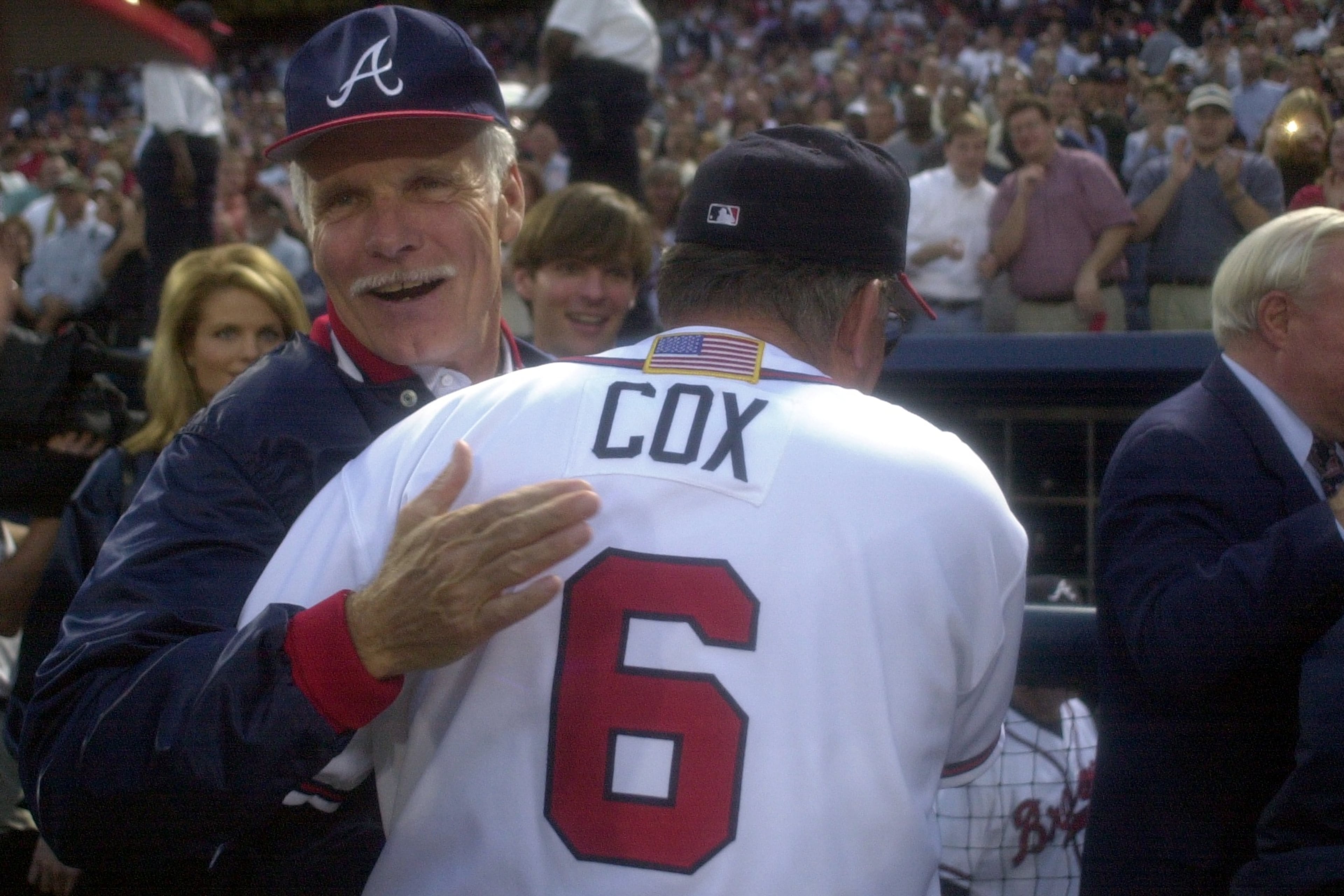 Longtime Braves owner Ted Turner (back) congratulates manager Bobby Cox on a win in the 2001 National League Division Series. (Marlene Karas/AJC 2001)