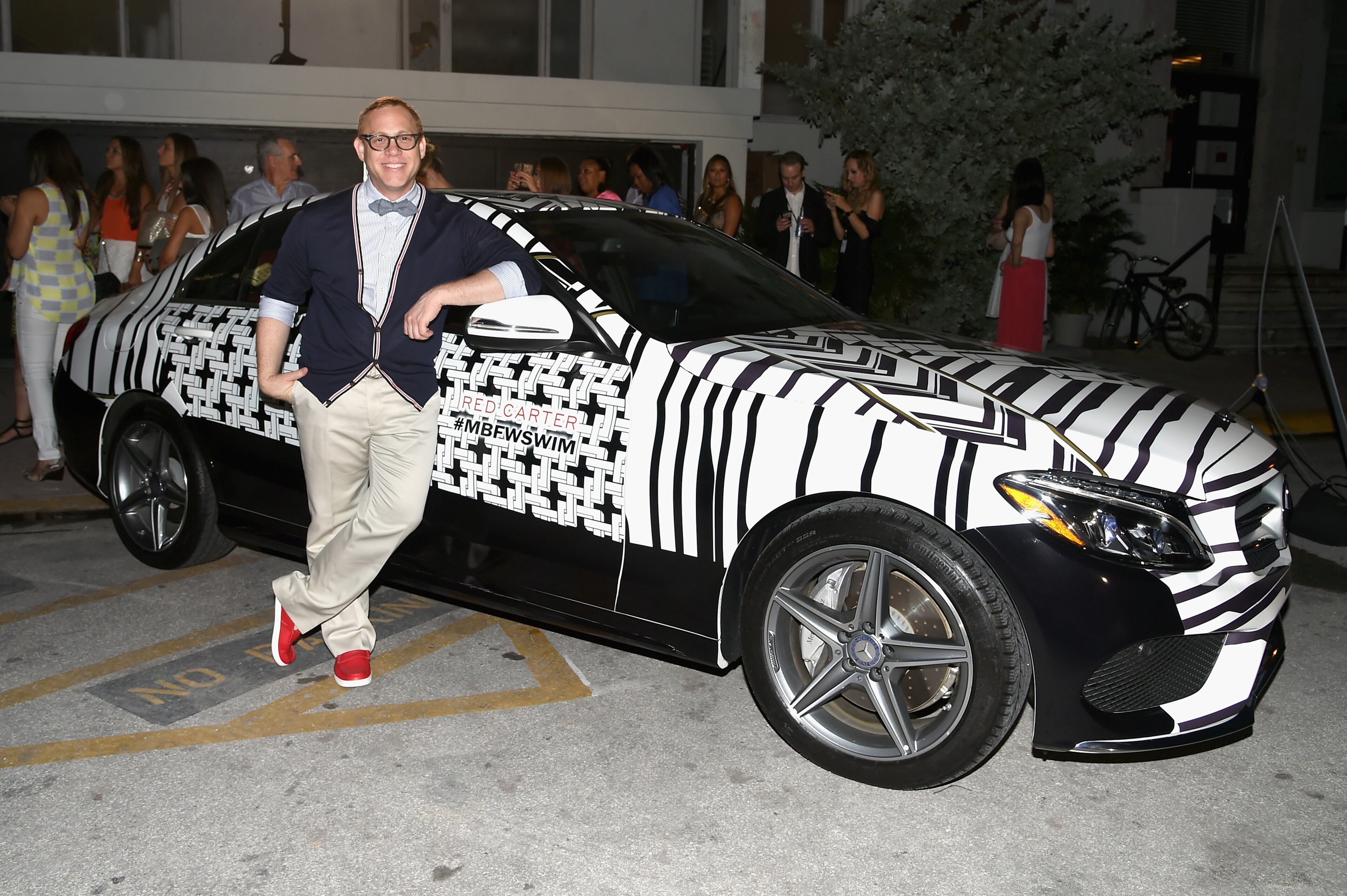 MIAMI BEACH, FL - JULY 17: Designer Designer Red Carter poses with a 2015 Mercedes-Benz C-Class featuring an exclusive design by Red Carter on display at the opening party celebrating 10 years during Mercedes-Benz Fashion Week Swim 2015 at The Raleigh on July 17, 2014 in Miami Beach, Florida. (Photo by Andrew H. Walker/Getty Images for Mercedes-Benz Fashion Week )