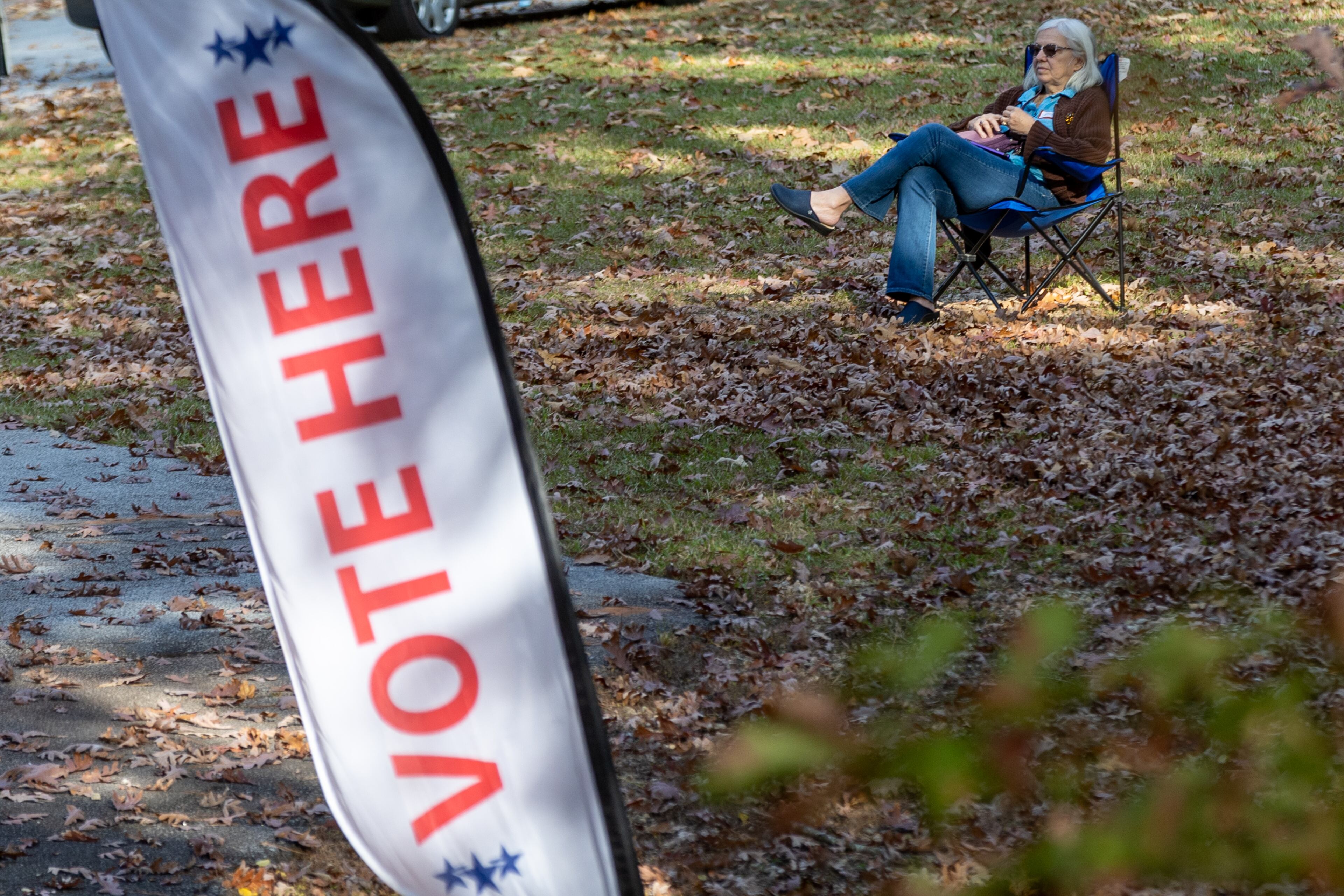 Poll Watcher Katherine Hanson sits outside the Solid Rock A.M.E. Zion Church on election day, Tuesday, Nov. 8, 2022. (Steve Schaefer/steve.schaefer@ajc.com)