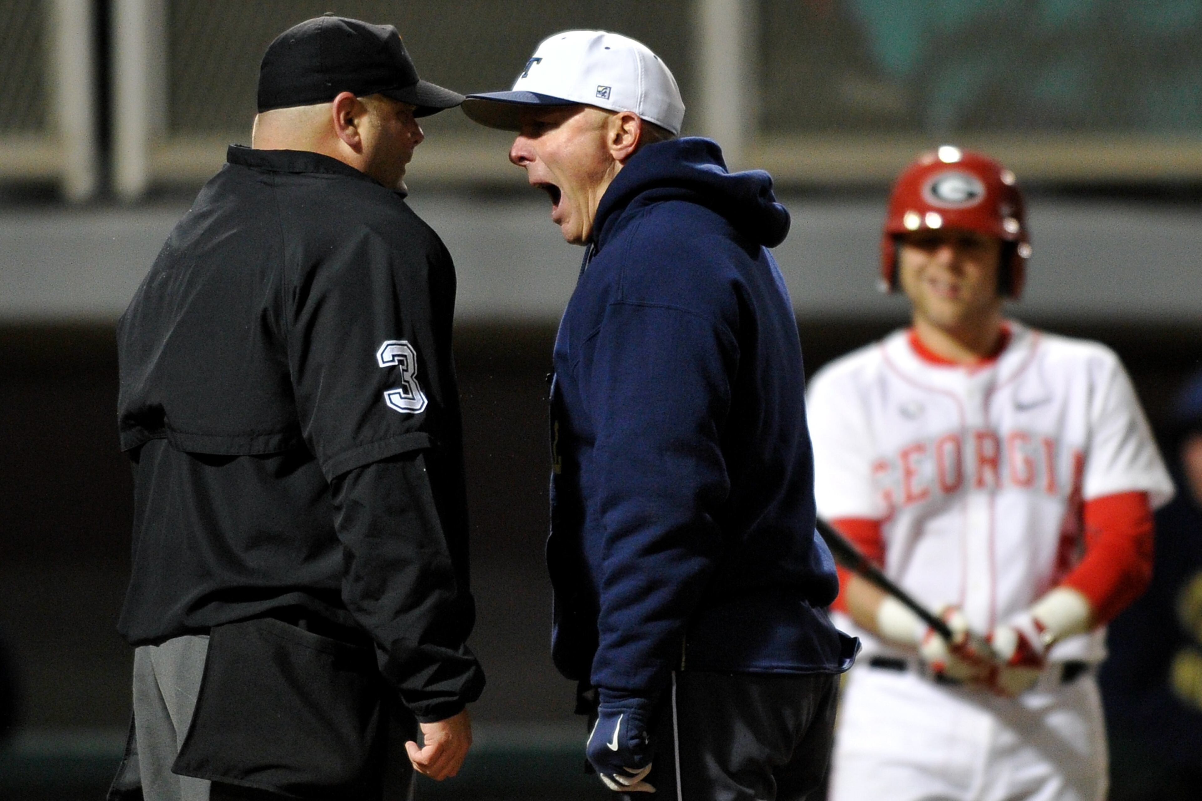 Georgia Tech coach Danny Hall argues with the home plate umpire during the bottom of the ninth inning of an NCAA college baseball game against Georgia on Tuesday, March 4, 2014, in Athens, Ga. Georgia won 1-0.