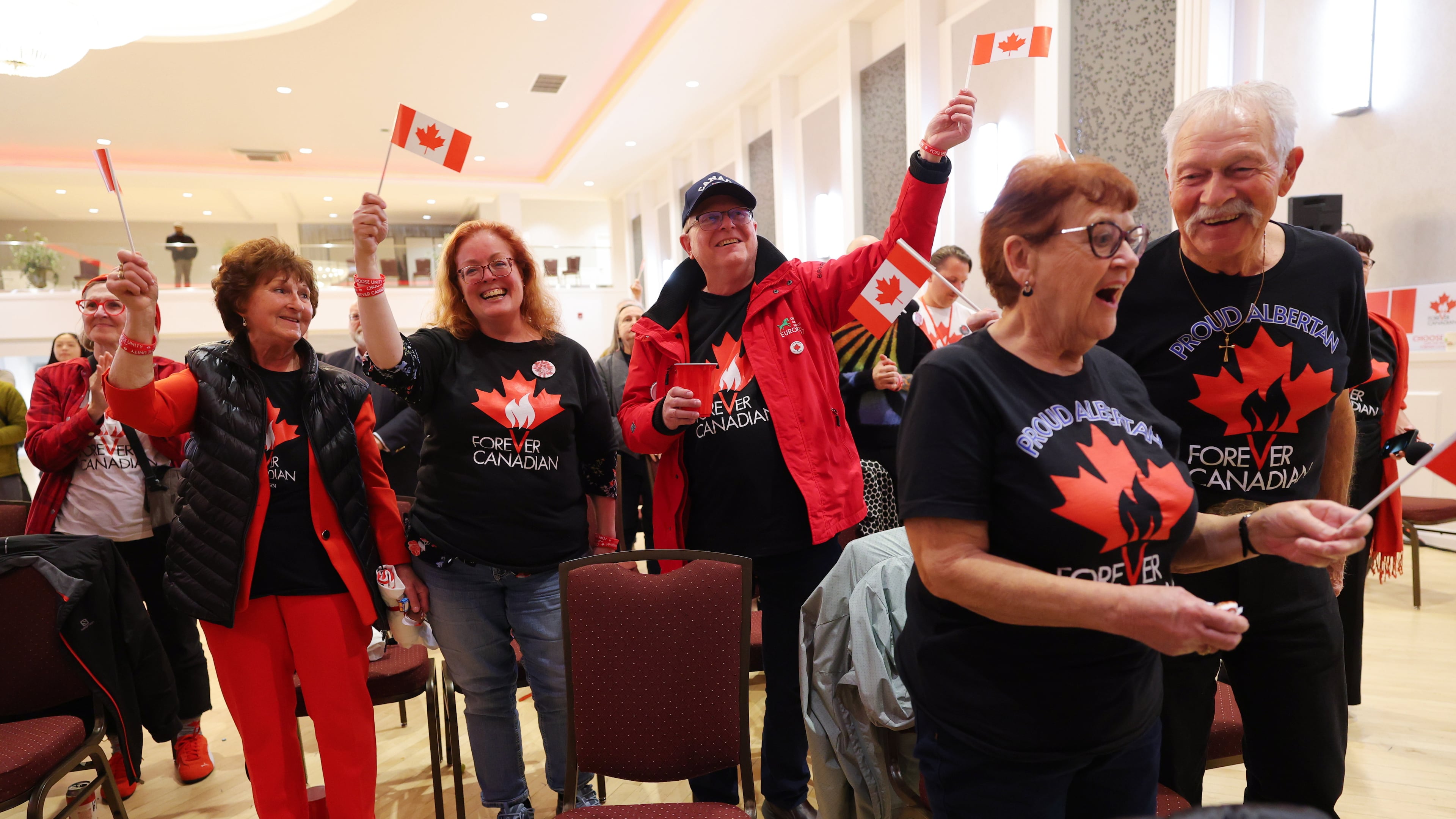 Supporters wait for results at the pro-Canada watch party in Edmonton, Alberta Monday, Oct. 19, 2026. (James Maclennan/The Canadian Press via AP)