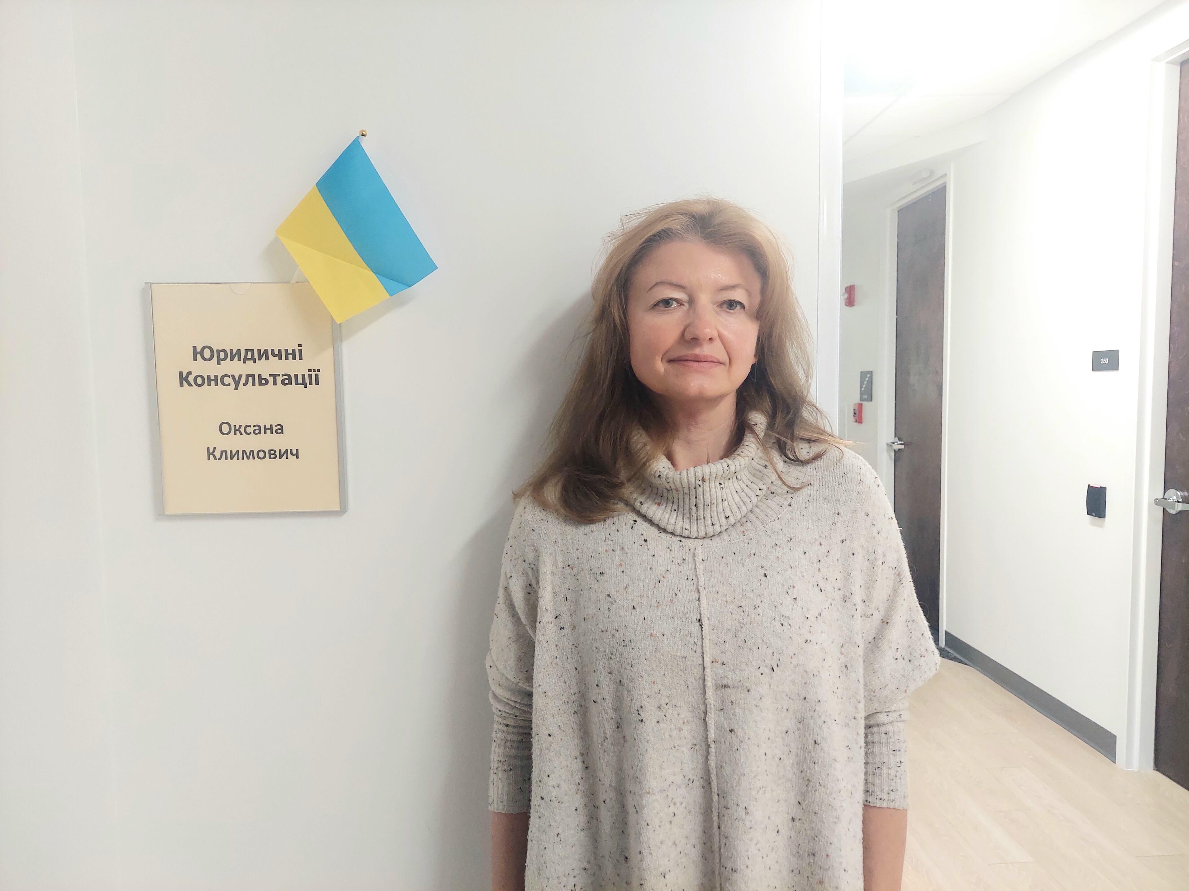 Oksana Klymovich, a volunteer with the Ukrainian Congress of Atlanta, stands next to the room where she provides free legal consultations for Ukrainian immigrants on Saturdays at the Ukrainian Cultural Center in Atlanta.