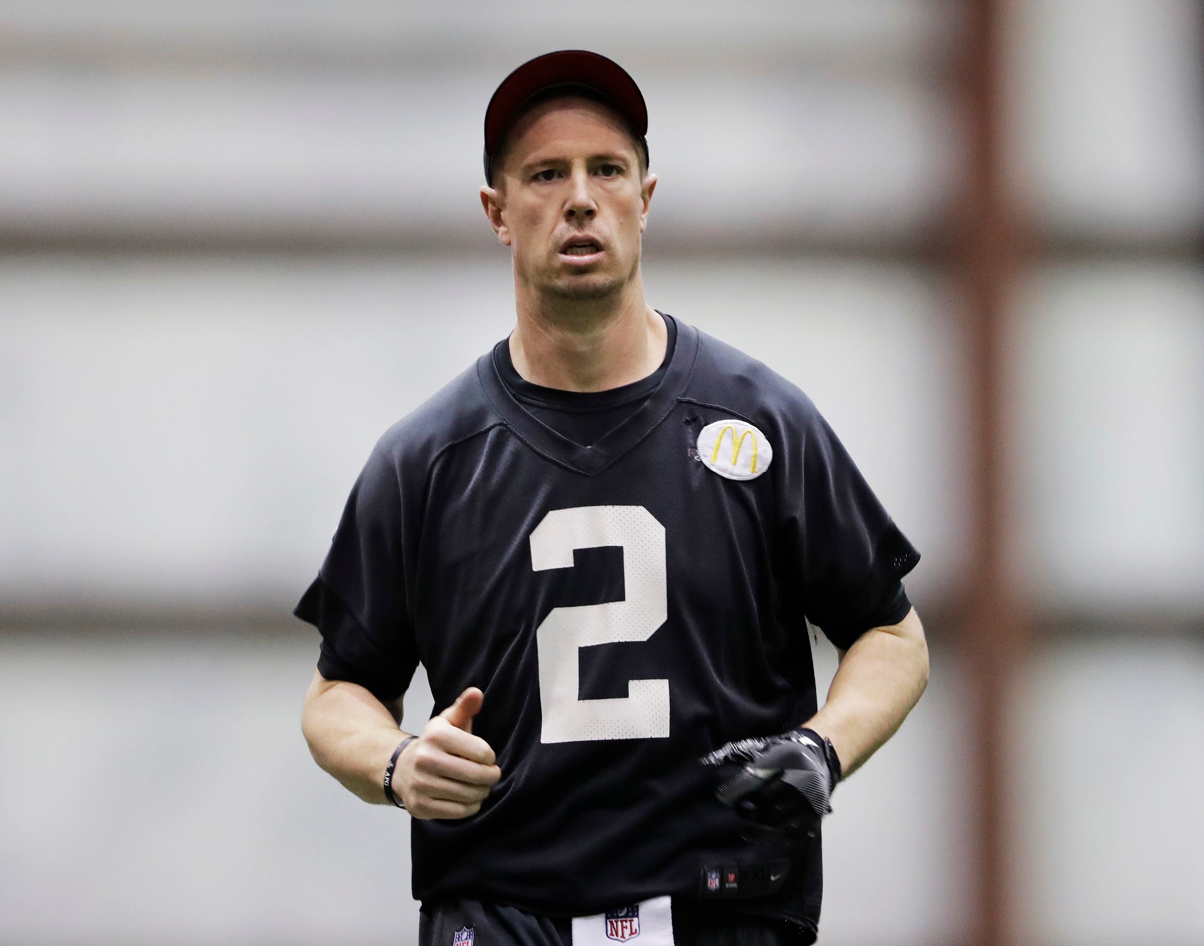 Atlanta Falcons quarterback Matt Ryan runs on the field during a workout at the NFL football team's practice facility in Flowery Branch, Ga., Friday, Jan. 27, 2017. (AP Photo/David Goldman)