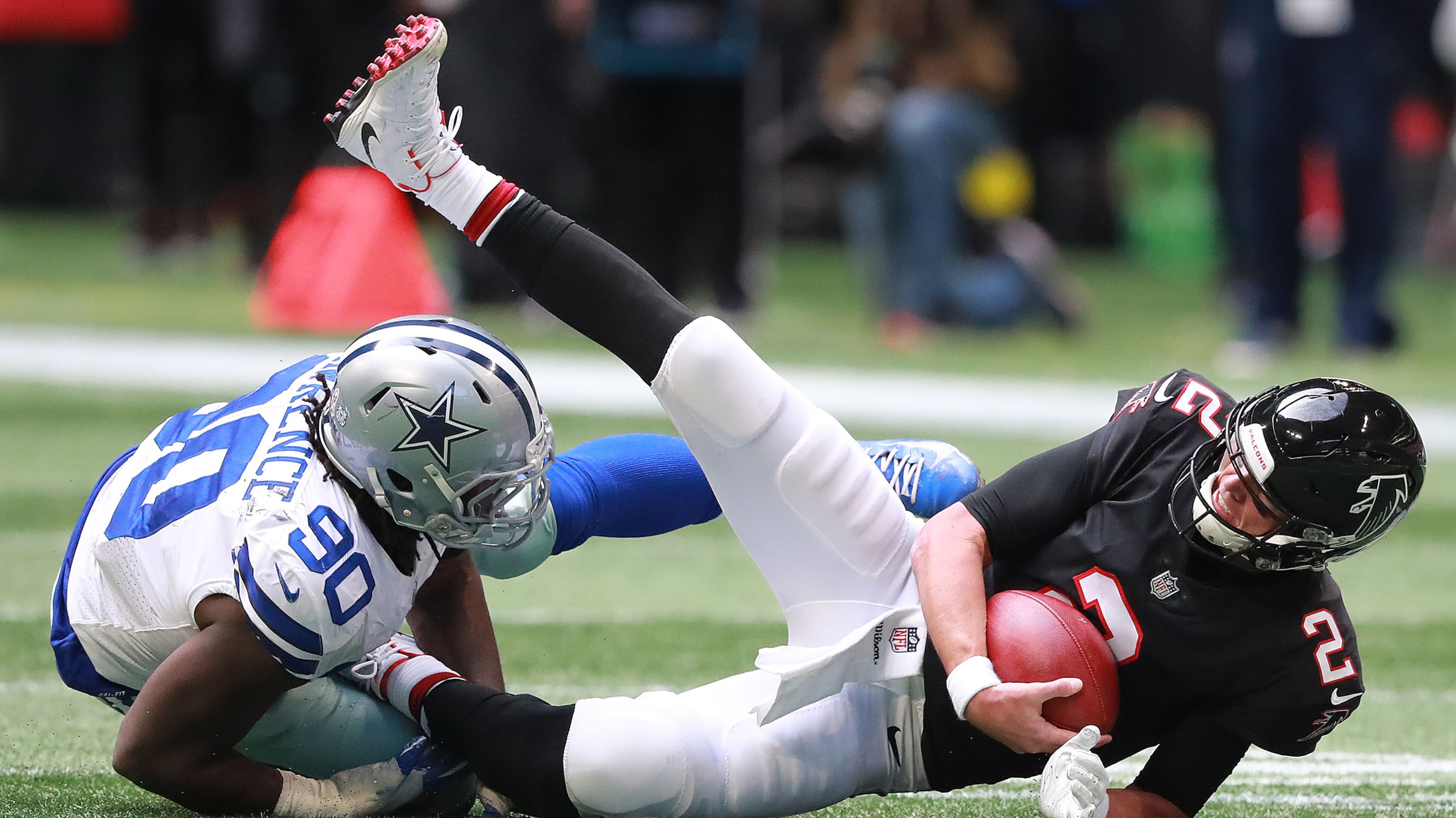 Falcons quarterback Matt Ryan is sacked by Dallas Cowboys defensive end Demarcus Lawrence during the second quarter in a NFL football game on Sunday, Nov. 18, 2018, in Atlanta. Curtis Compton/ccompton@ajc.com