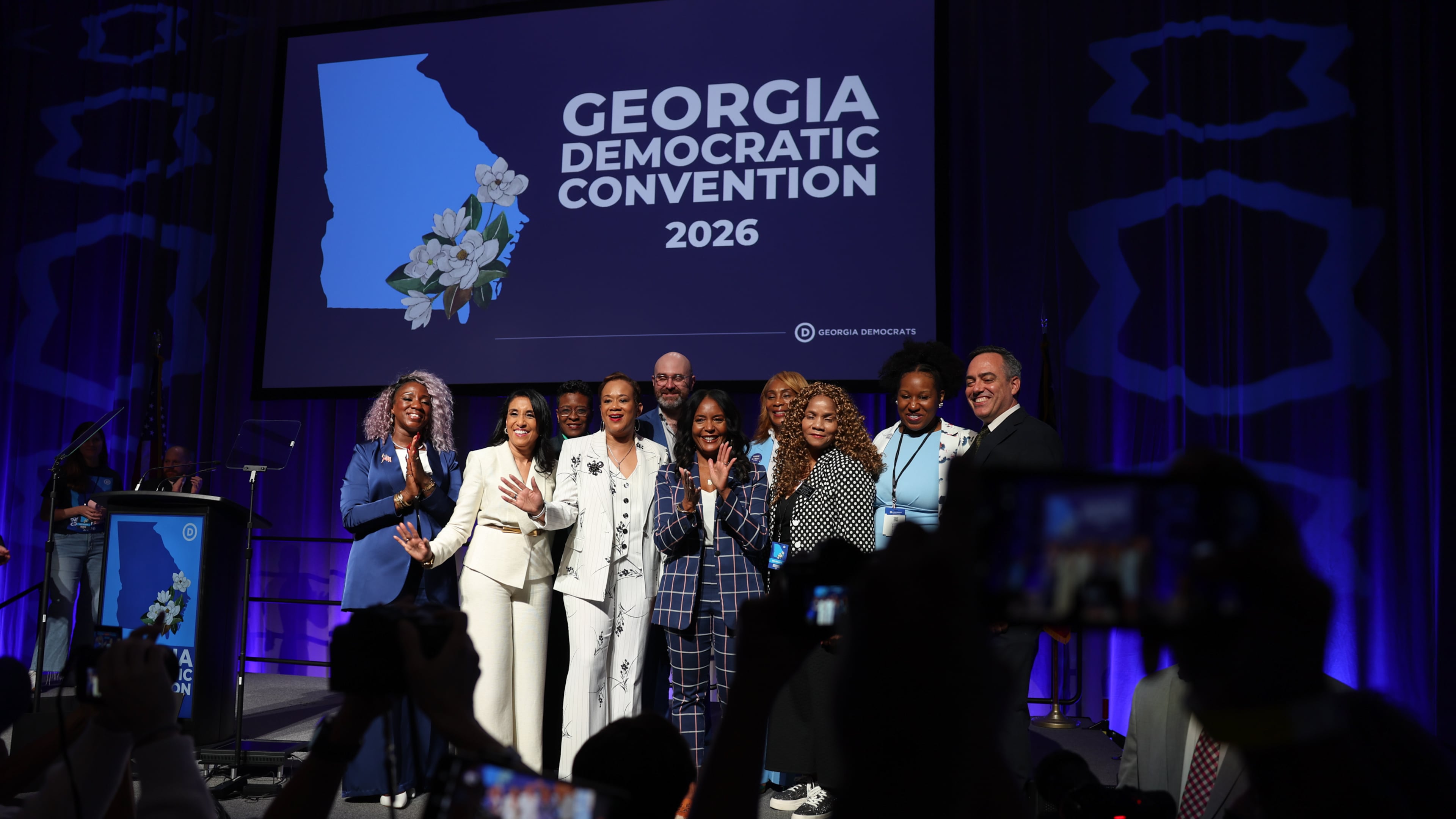 Statewide Democratic candidates, including gubernatorial candidate Keisha Lance Bottoms (center, in dark blue), gather for a photo Saturday, Aug. 1, 2026, at the Democratic Party of Georgia State Convention at the Savannah Convention Center. (Arvin Temkar/AJC)