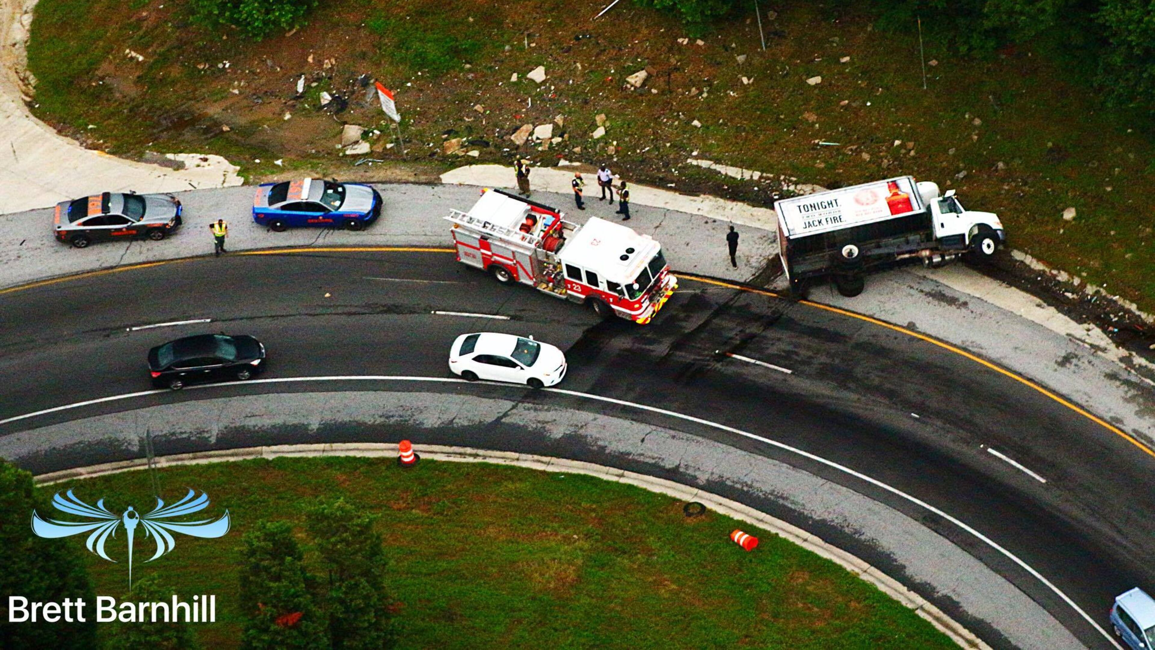An overturned liquor truck is blocking a ramp from I-75 South to I-85 North. (Credit: Brett Barnhill)