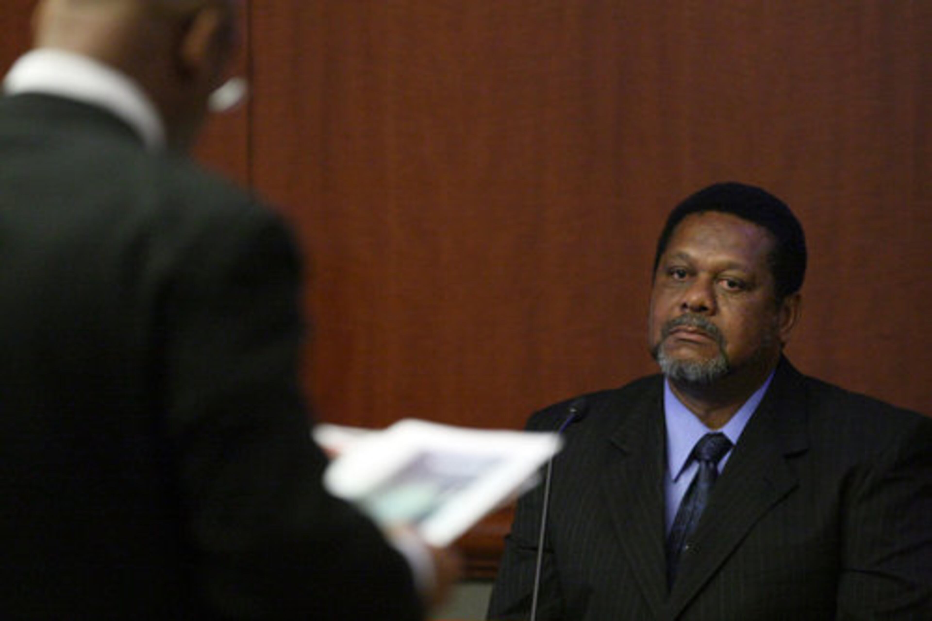 Retired Fulton County Deputy Grantley White responds to prosecutor Clint Rucker about the 2005 Fulton County Courthouse killings. White is credited as being one of the heroes; he faked a heart attack to sound an alarm and made a distress radio call to alert authoriities that Nichols had escaped.