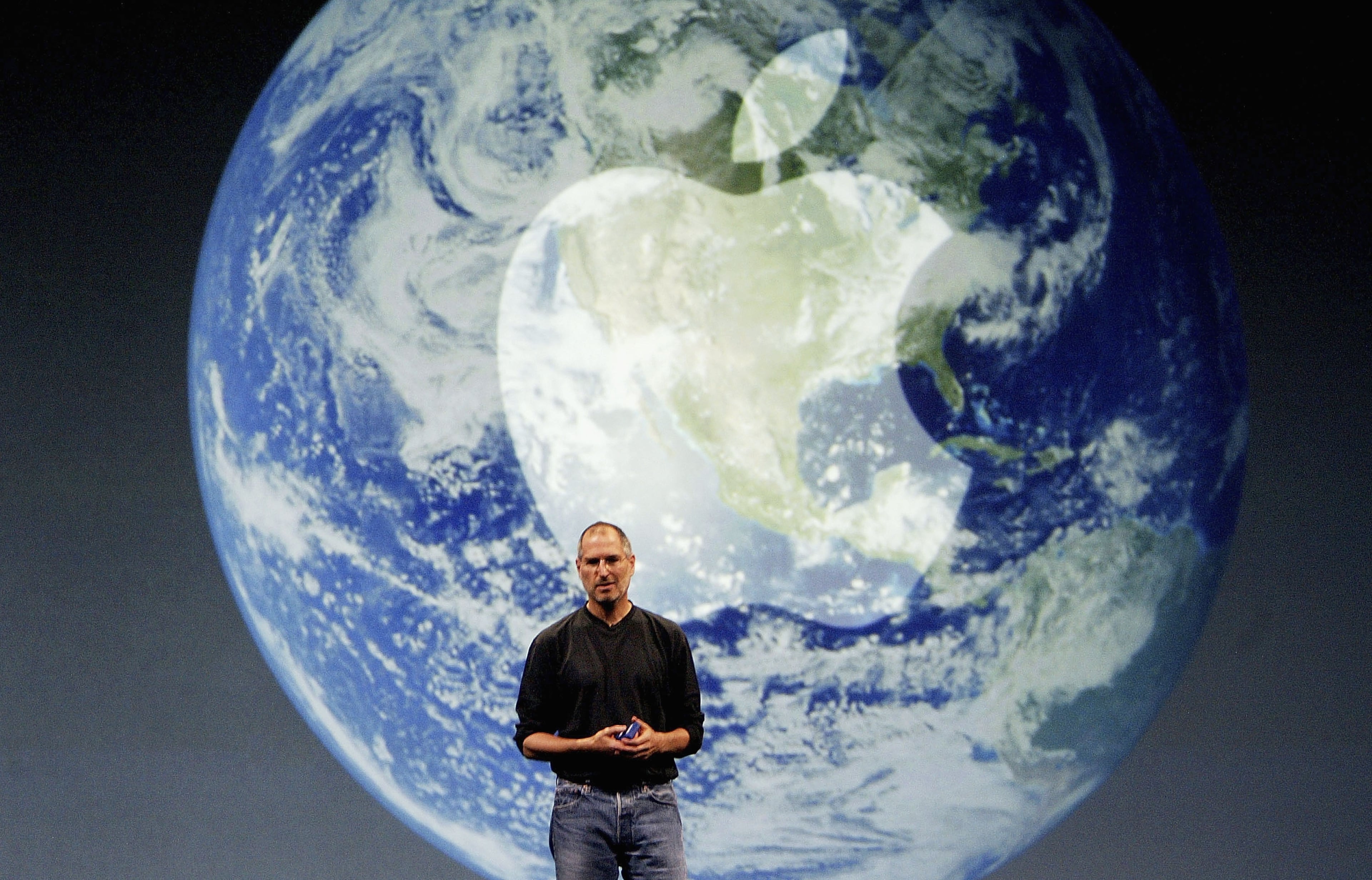 Steve Jobs, Chief Executive Officer of Apple computers, launches iTunes Music Store in the territories of Great Britain, Germany and France, on June 15, 2004 in London. The iTunes store allows users to buy and download albums or individual songs from a library of 700,000 songs. (Photo by Ian Waldie/Getty Images)
