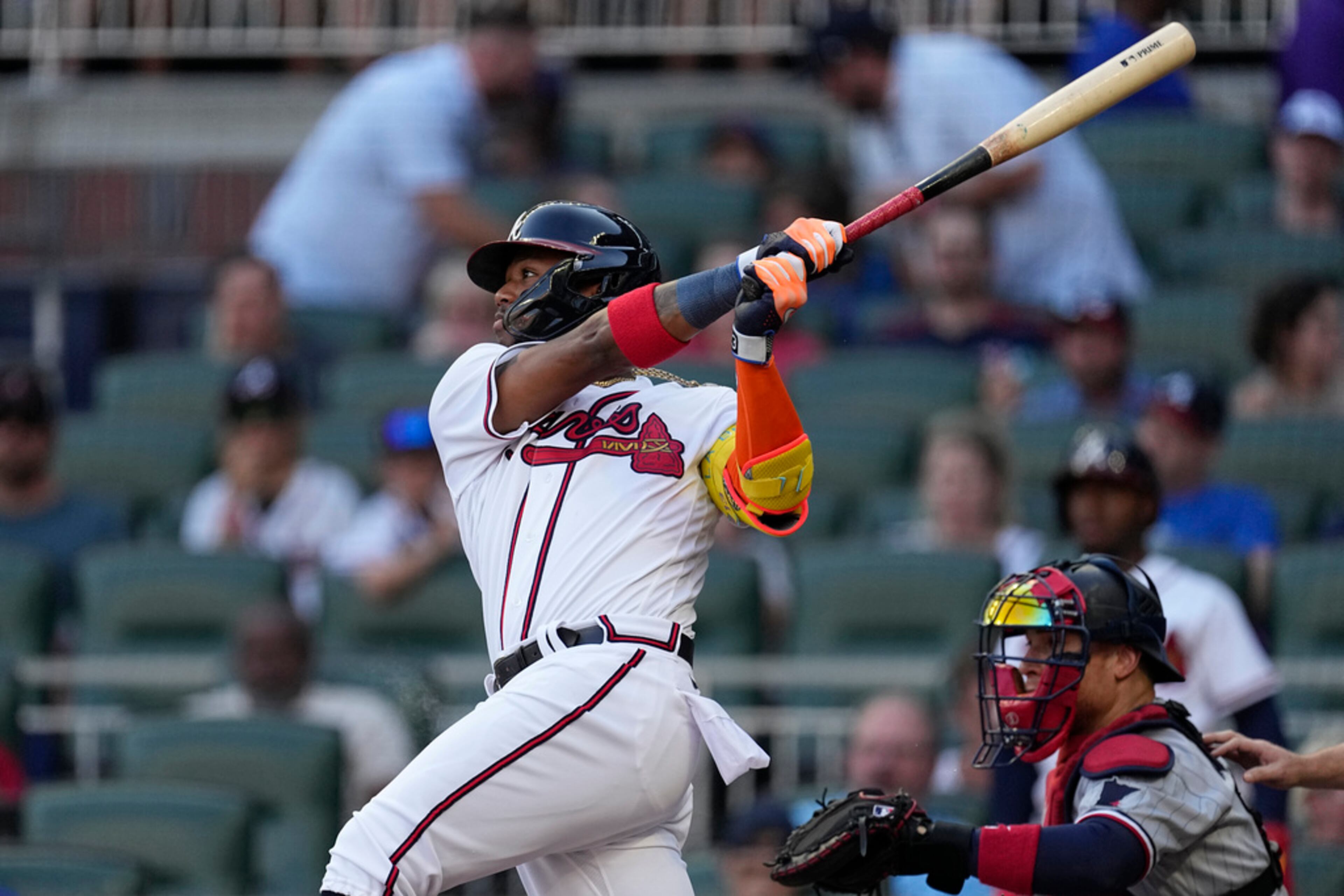 Atlanta Braves' Ronald Acuna Jr. watches his solo home run, next to Minnesota Twins catcher Christian Vazquez during the first inning of a baseball game Tuesday, June 27, 2023, in Atlanta. (AP Photo/John Bazemore)