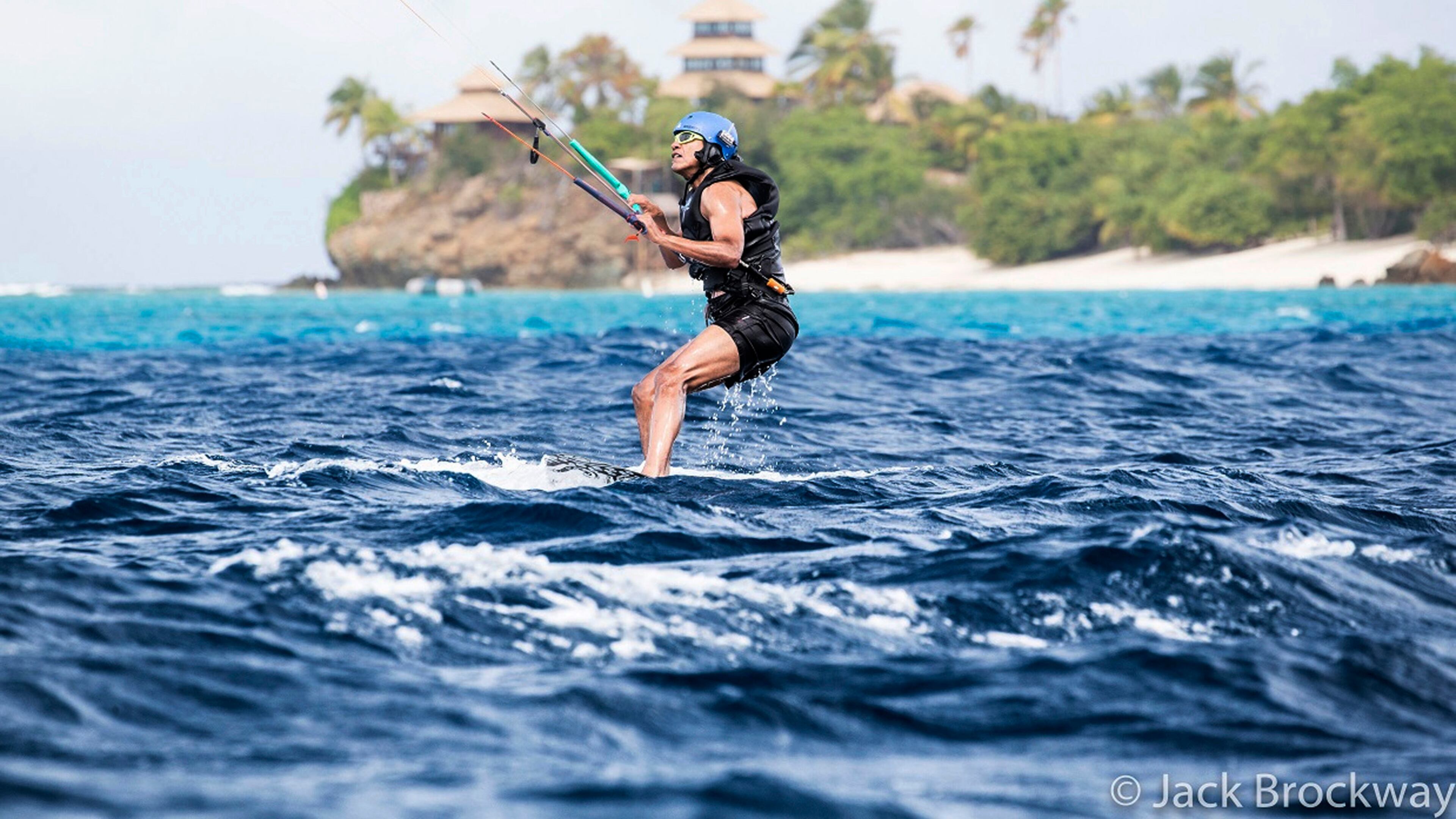 In this recent but undated photo made available by Virgin.com, former U.S President Barack Obama kitesurfs during his stay on Moskito Island, British Virgin Islands. The former president and his wife stayed on Mosikto Island owned by Richard Branson, founder of the Virgin Group, after he finished his second term as President and left the White House. (Jack Brockway/Virgin.com via AP)