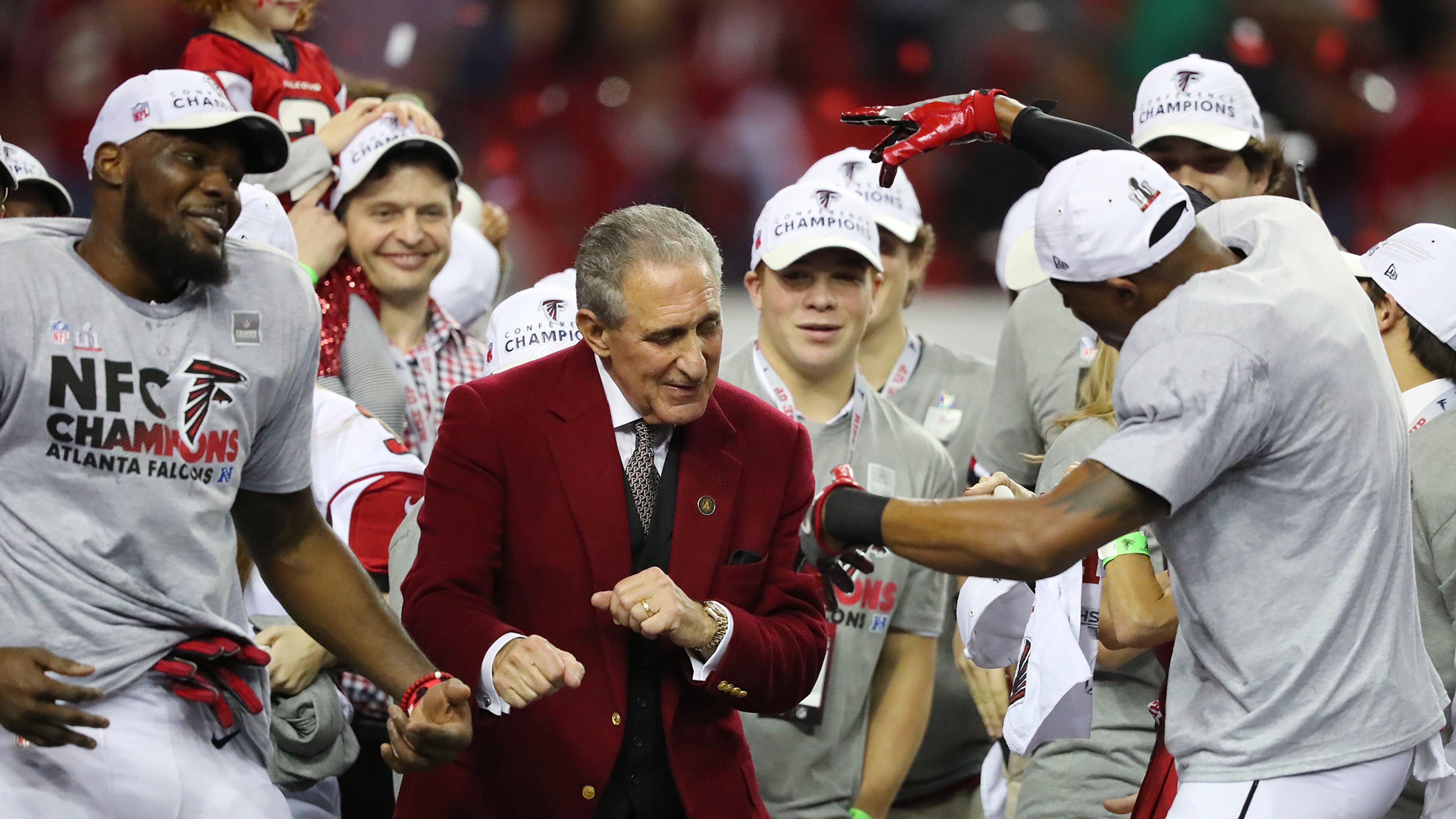 Falcons owner Arthur Blank dances on stage with his players after beating the Packers 44-21 in the NFL football NFC Championship game on Sunday, Jan. 22, 2017, in Atlanta. Curtis Compton, ccompton@ajc.com