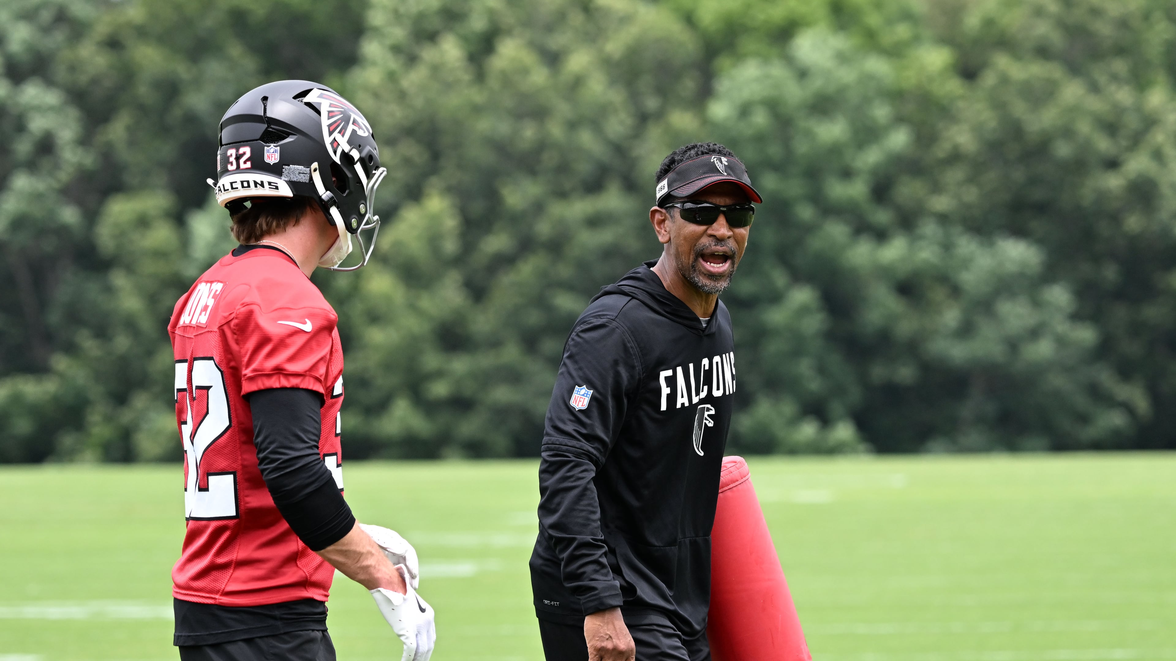 Falcons wide receivers coach Robert Prince (right) gives instructions during an OTA workout on Wednesday, May 27, 2026, in Flowery Branch. Prince is responsible for maximizing Atlanta’s receiving corps, no matter the form it takes. (Hyosub Shin/AJC)