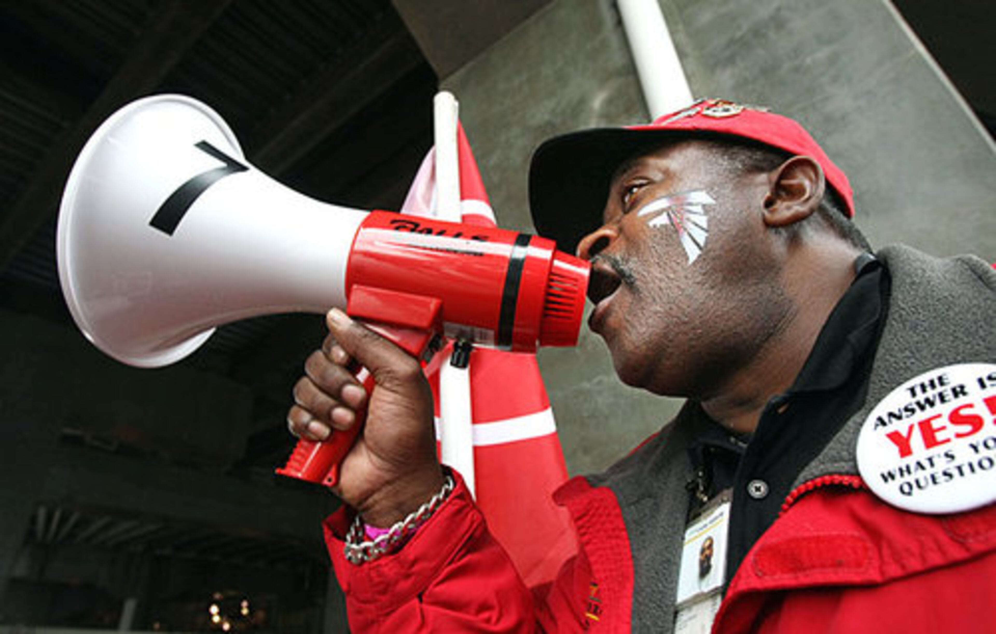 Let's go Falcons! Information specialist Royal Clark uses a bullhorn to fire up Falcons fans as they arrive at Gate D of the Georgia Dome for the Falcons final regular season game against the St. Louis Rams in Atlanta, Sunday.