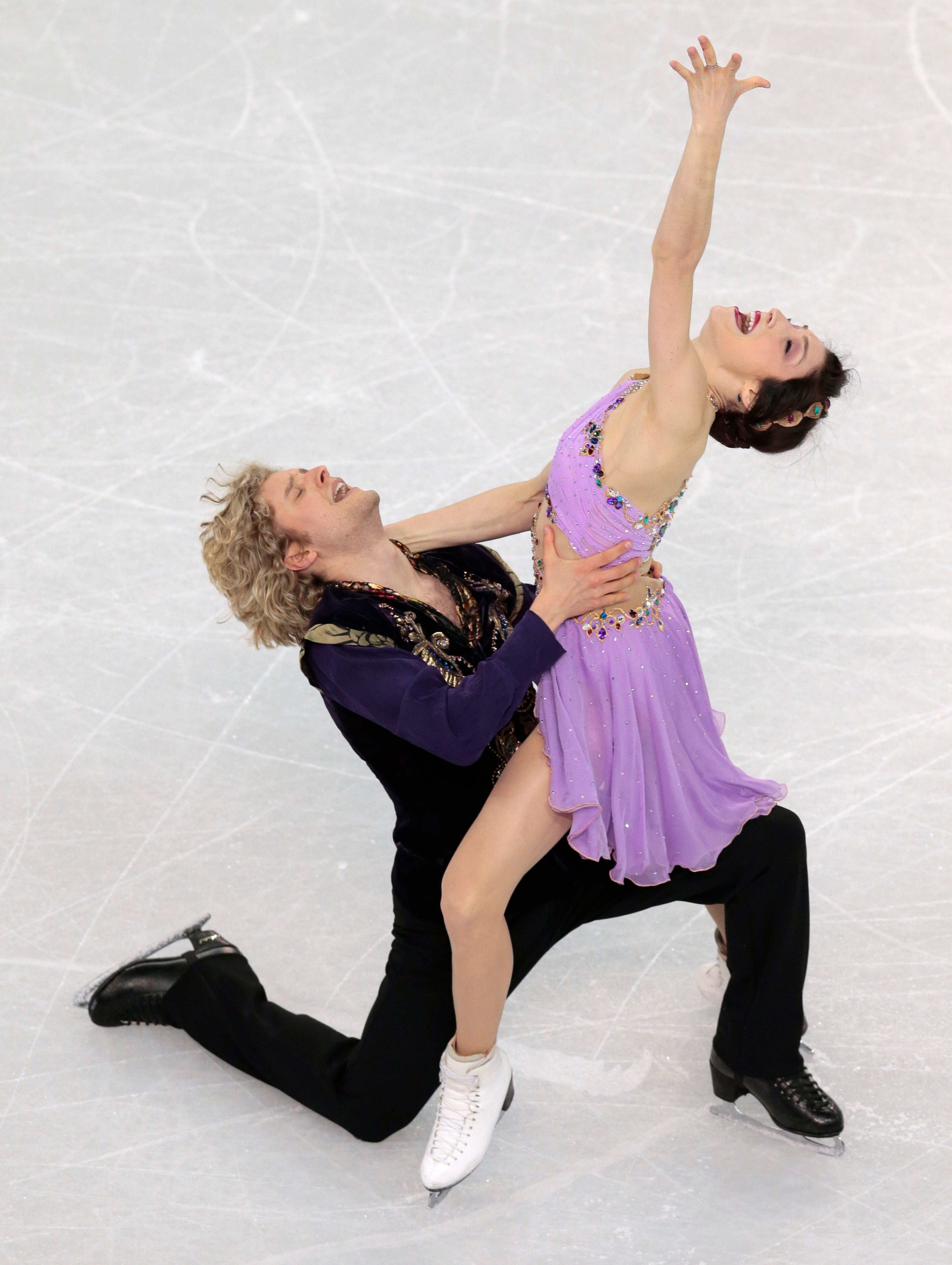 Meryl Davis and Charlie White of the United States compete in the ice dance free dance figure skating finals at the Iceberg Skating Palace during the 2014 Winter Olympics, Monday, Feb. 17, 2014, in Sochi, Russia. (AP Photo/Ivan Sekretarev)