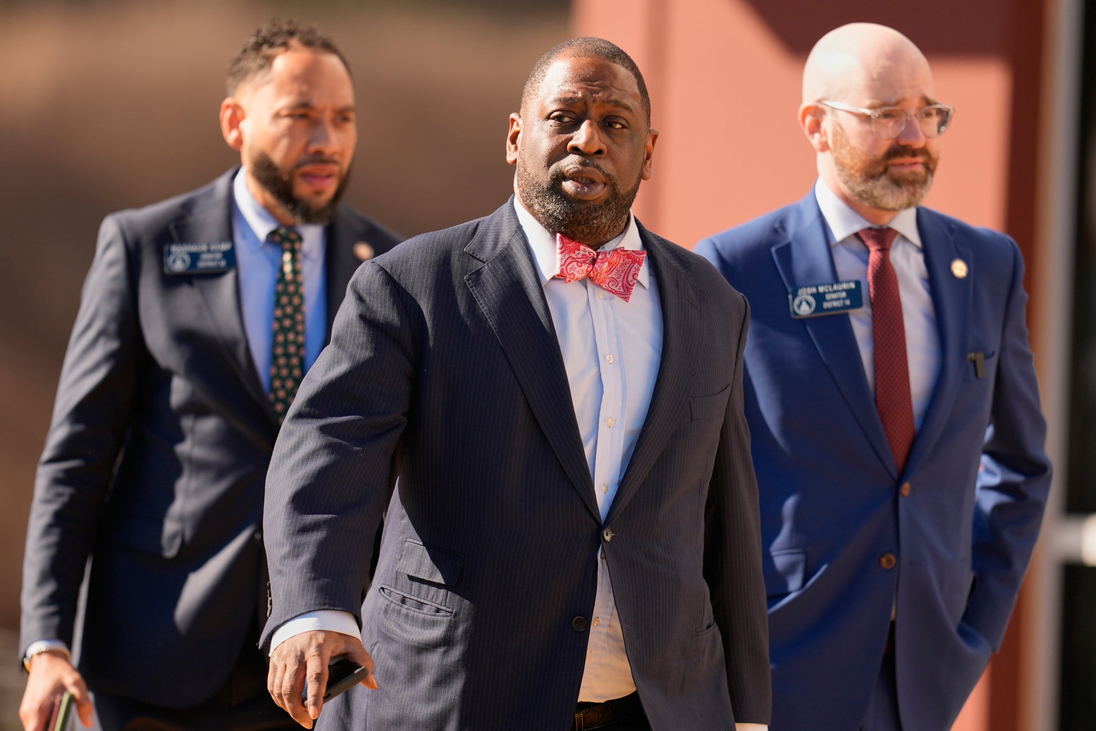(Left to right) State Sen. RaShaun Kemp, Fulton County Commissioner Marvin Arrington Jr. and state Sen. Josh McLaurin turned out in Union City, Ga., as FBI agents search at the Fulton County Election Hub and Operation Center on Wednesday. (Mike Stewart/AP)