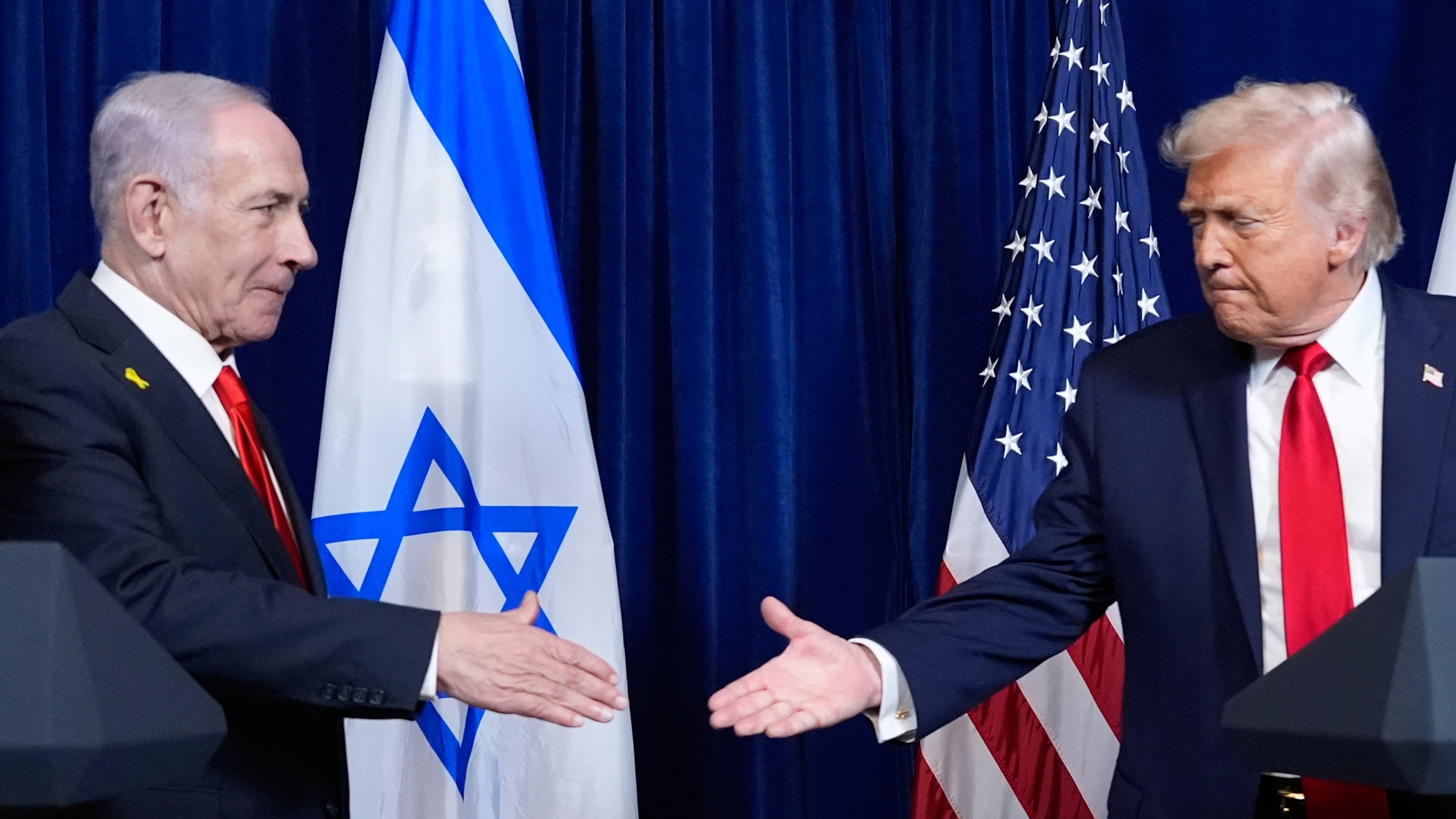 FILE - President Donald Trump shakes hands with Israel's Prime Minister Benjamin Netanyahu at the end of a news conference at Mar-a-Lago, Dec. 29, 2025, in Palm Beach, Fla. (AP Photo/Alex Brandon, File)