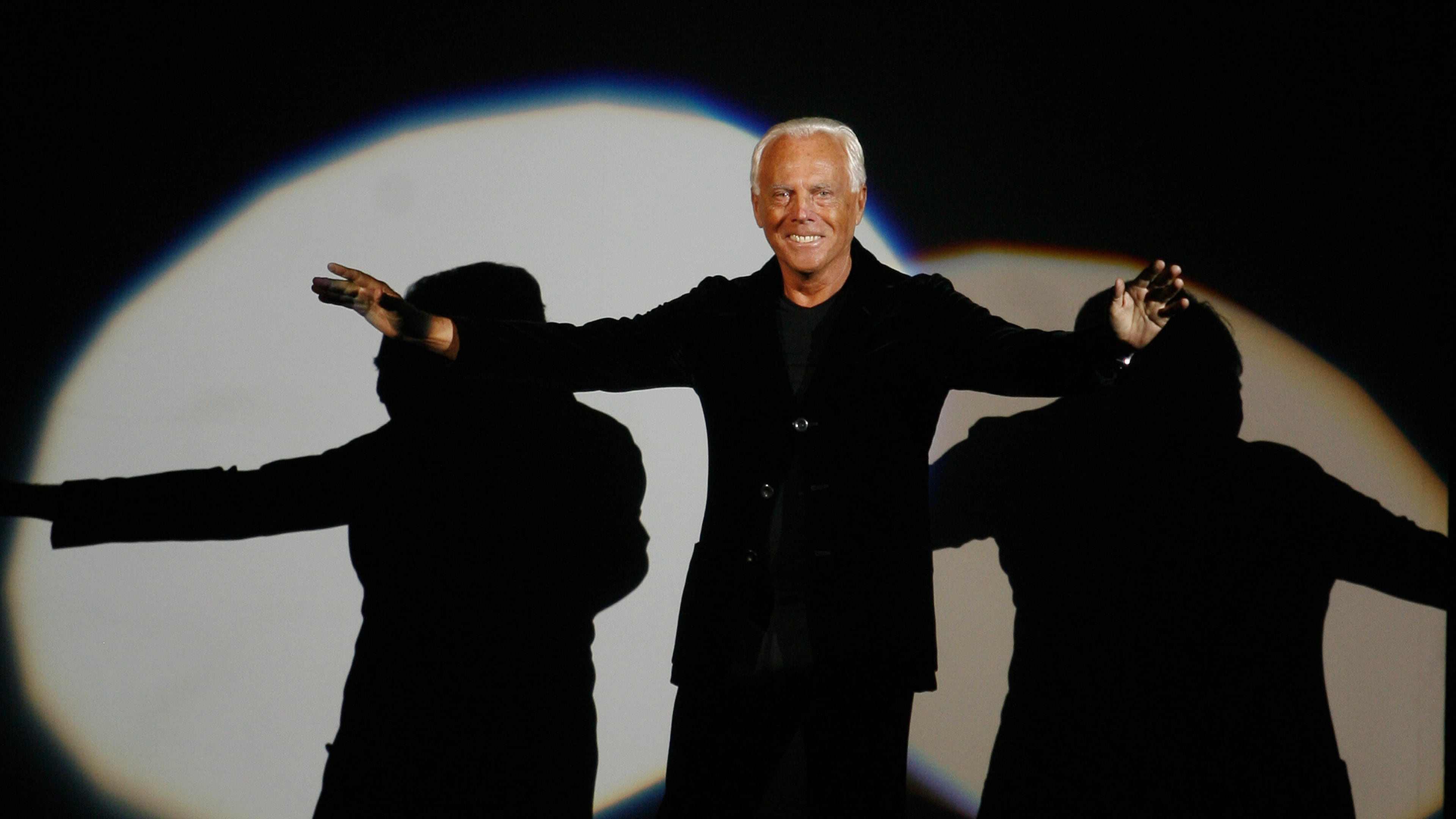FILE - Giorgio Armani receives his share of applause after presenting his Emporio Fall-Winter 2007-2008 men's fashion collection, during the Milan Men's Fashion Week, in Milan, Italy, Monday, Jan. 15, 2007. (AP Photo/Luca Bruno, File)