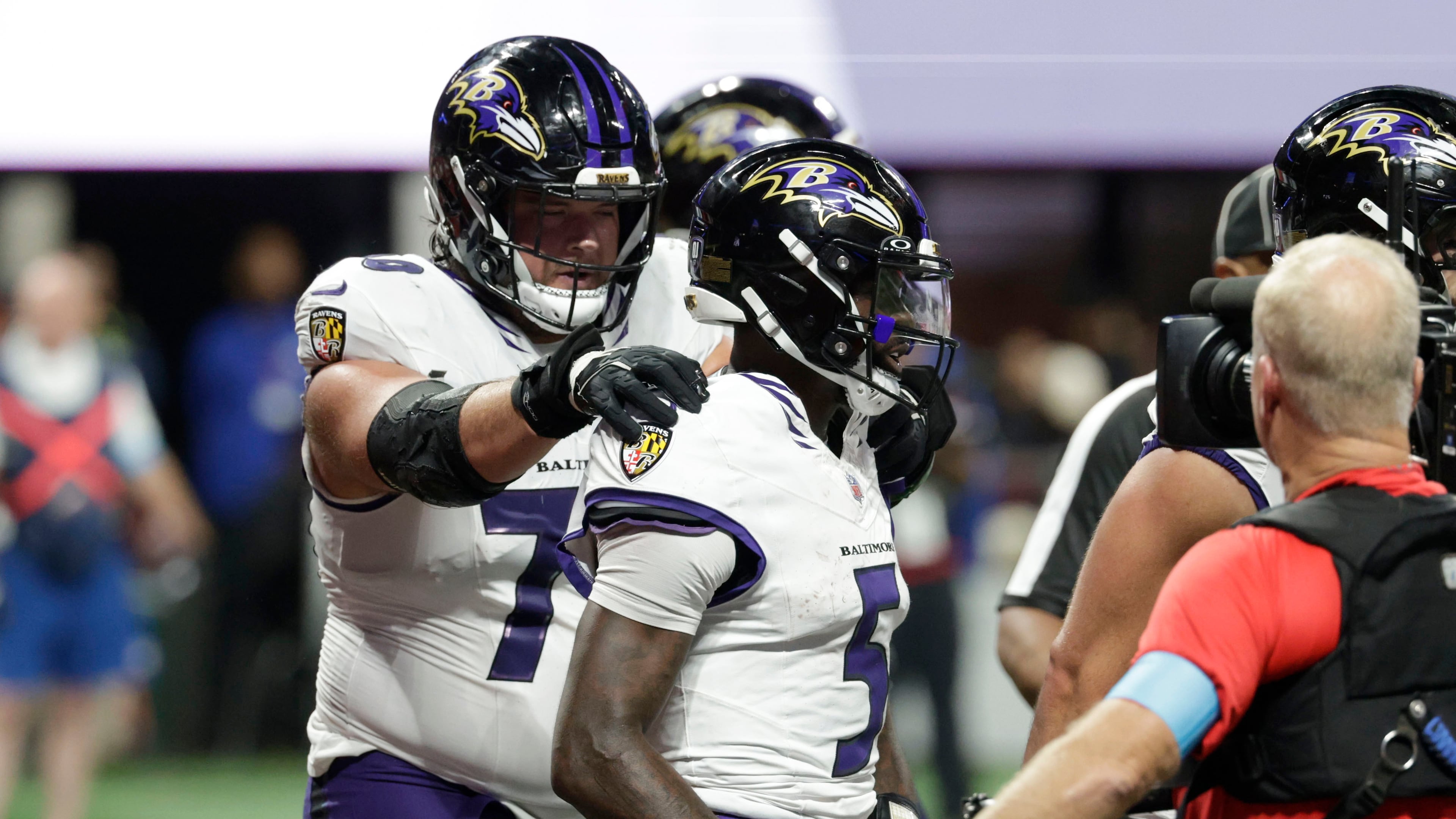 Baltimore Ravens quarterback Tyler Huntley (5) celebrates with teammates after a touchdown run during overtime in a NFL football game against the Atlanta Falcons, Sunday, Oct. 11, 2026, in Atlanta. (AP Photo/Erik S. Lesser)