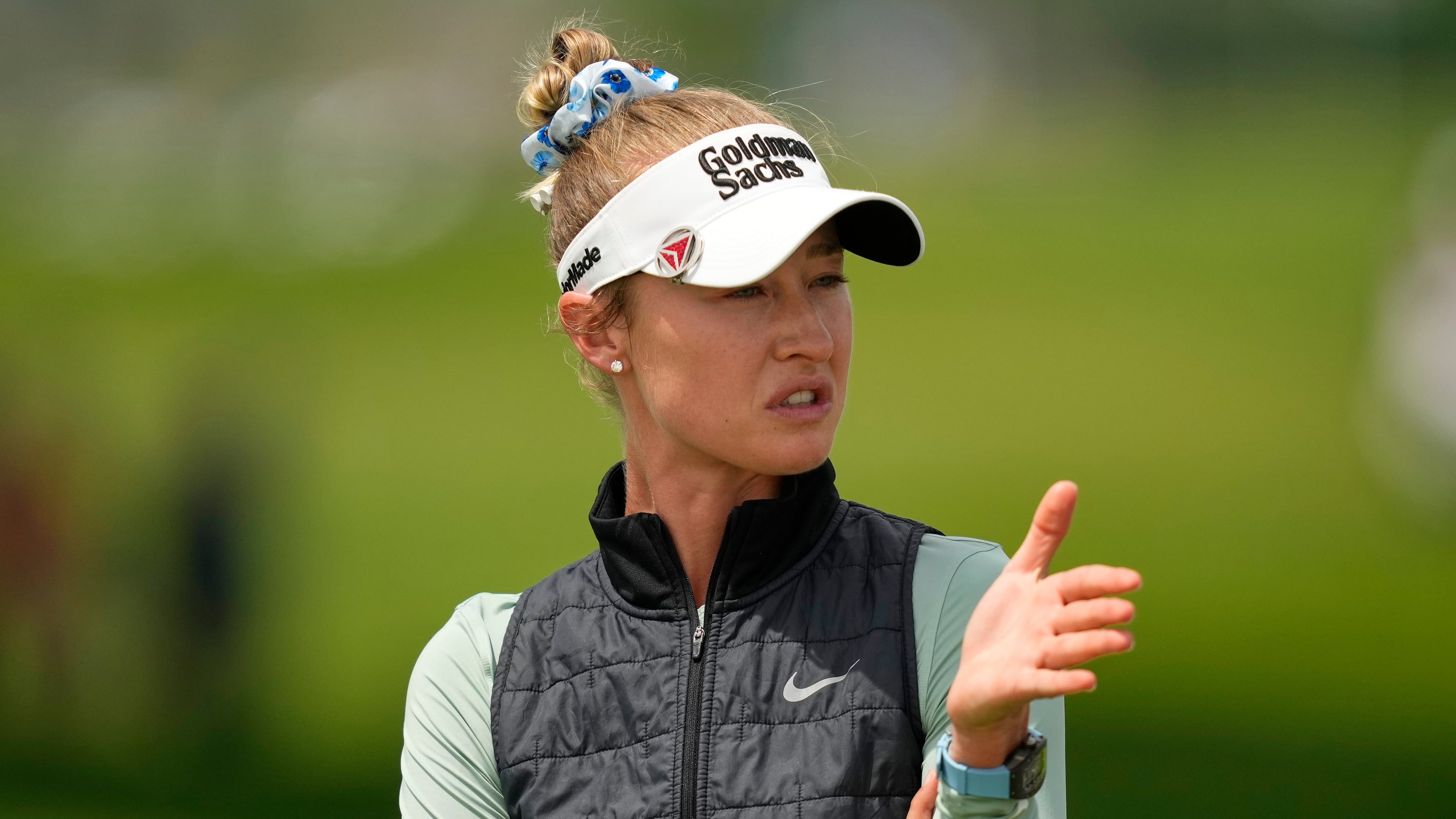 Nelly Korda talks to her caddie on the first hole during the final round of the Women's PGA Championship golf tournament at Hazeltine National Golf Club, Sunday, June 28, 2026, in Chaska, Minn. (AP Photo/Matt York)
