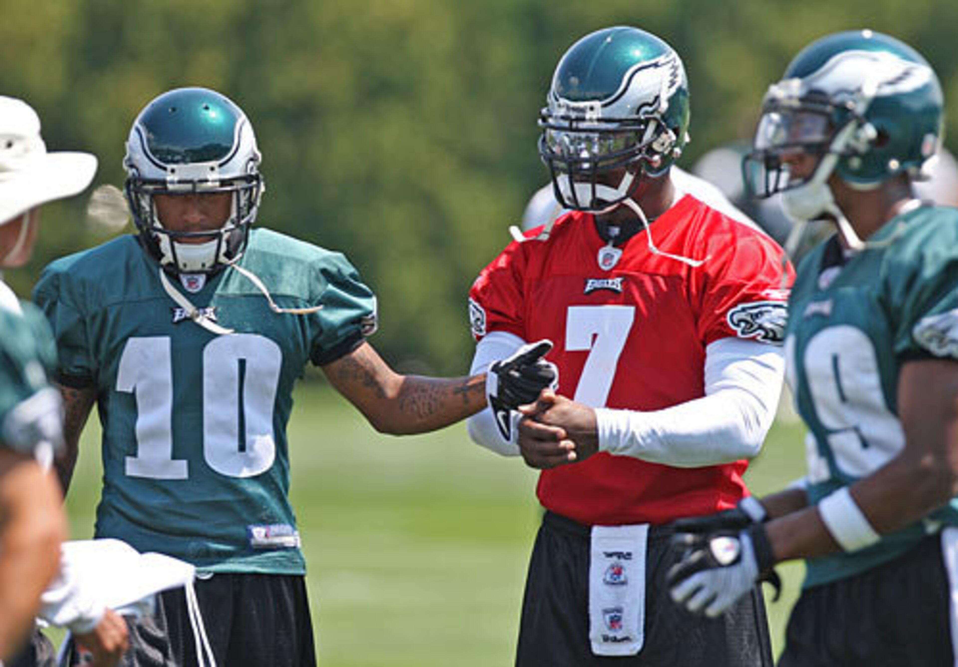 Eagles receiver DeSean Jackson (10) gives an encouraging fist pump to new teammate Michael Vick (7) during practice in Philadelphia Saturday, August 15.