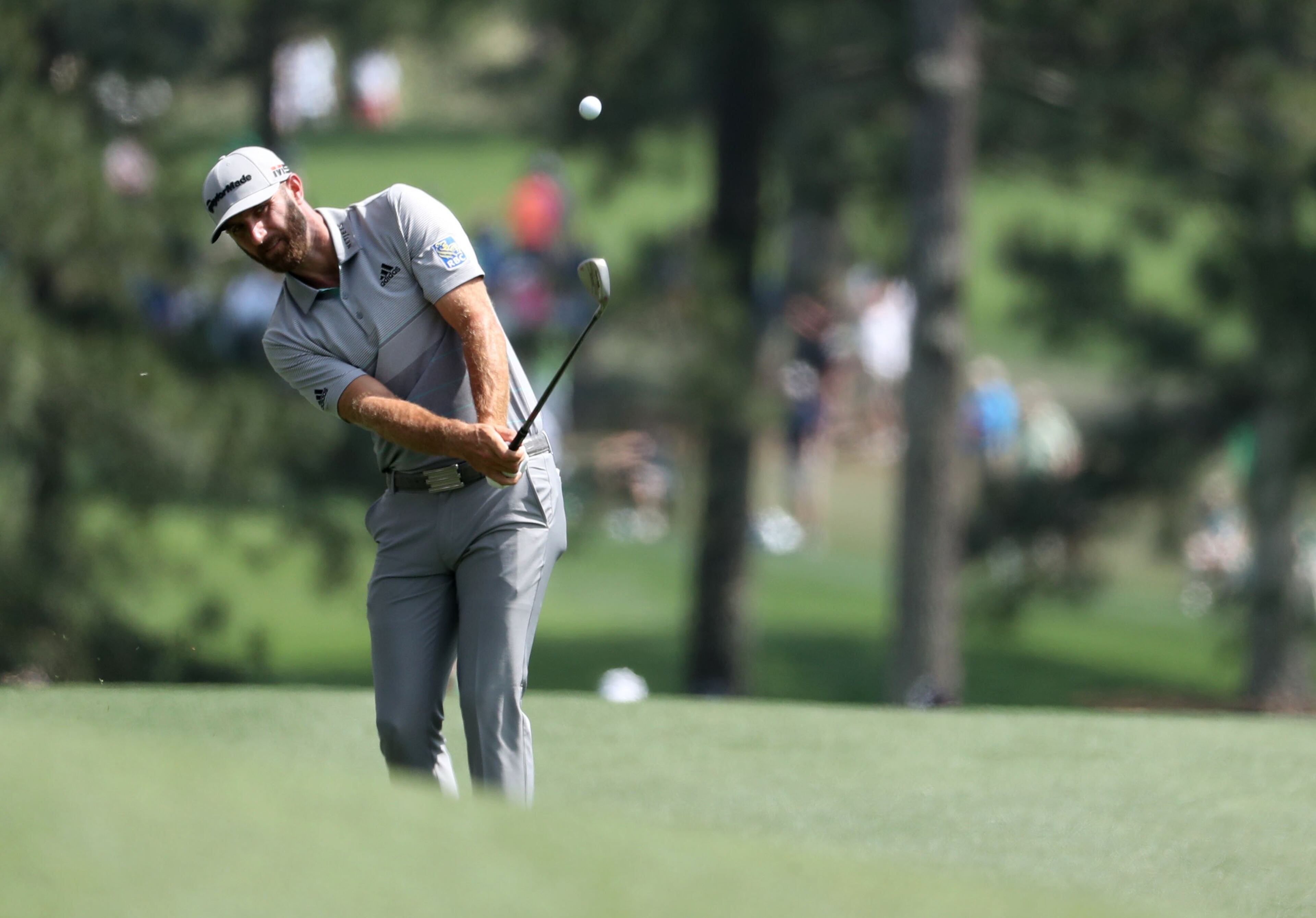 April 13, 2019 - Augusta - Dustin Johnson hits his fairway shot on 3 during the third round of the Masters Tournament Saturday, April 13, 2019, at Augusta National Golf Club in Augusta. Jason Getz / Special to the AJC