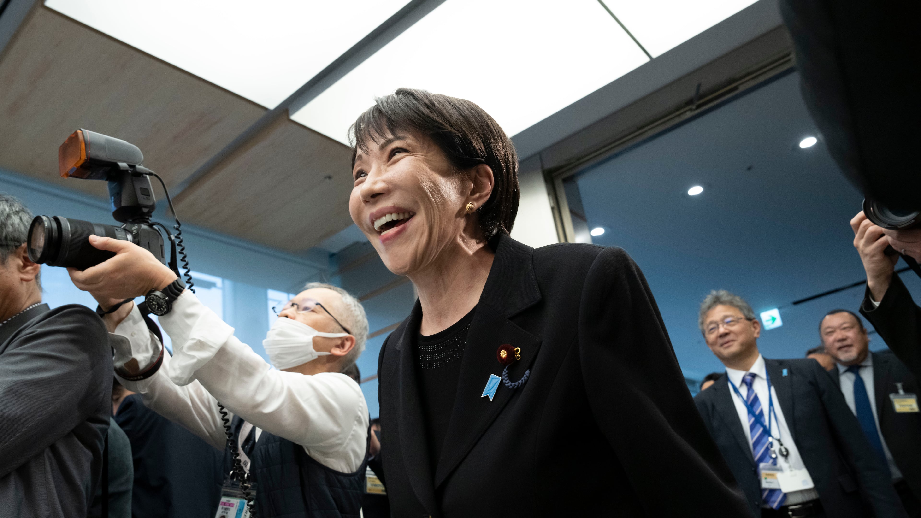 Japan's Prime Minister Sanae Takaichi, arrives for a meeting with members of British rock band Deep Purple at the Prime Minister's Office in Tokyo, Friday, April 10, 2026. (Yuichi Yamazaki/Pool Photo via AP)