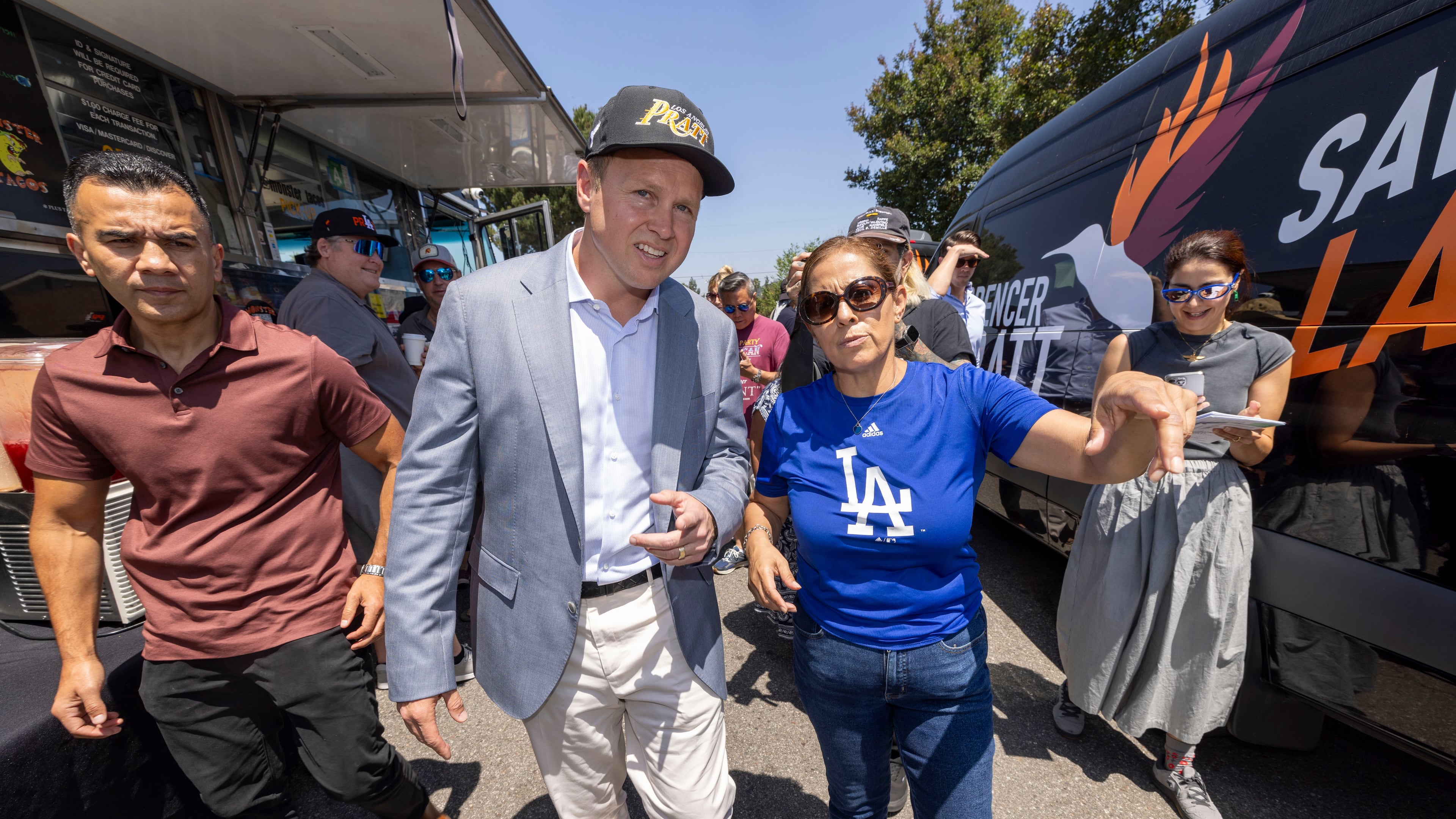 Los Angeles mayoral candidate Spencer Pratt gets shown around the neighborhood by Maggie Quiroz during a campaign event Sunday, May 31, 2026, in Los Angeles. (AP Photo/Jill Connelly)