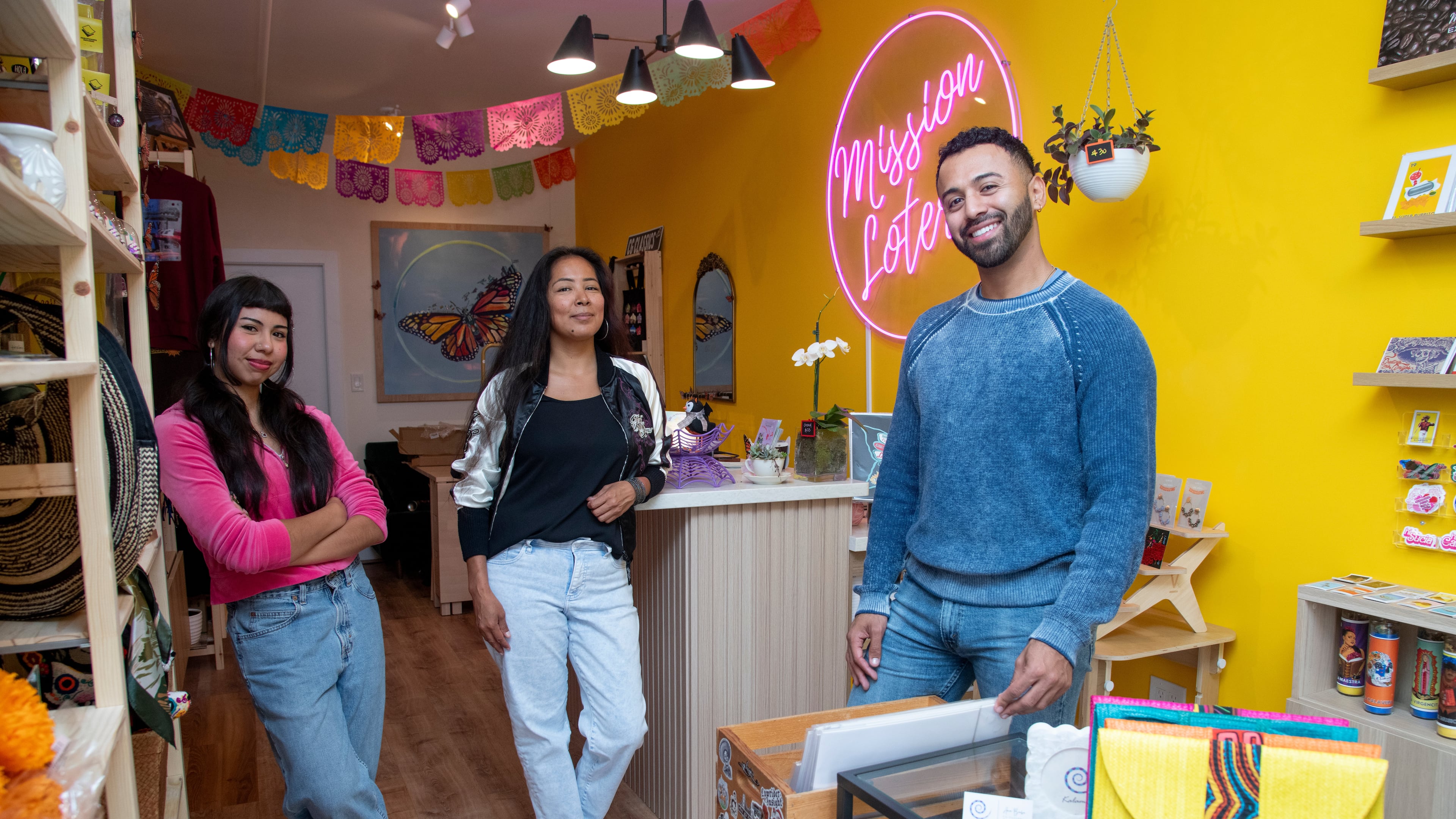 Store associate Dalia Rangel, store manager Paloma Flores and CEO Luis Quiroz pose for a portrait at the Mission Loteria store on Friday, Oct. 9, 2026, in San Francisco. (AP Photo/Akash Pamarthy)