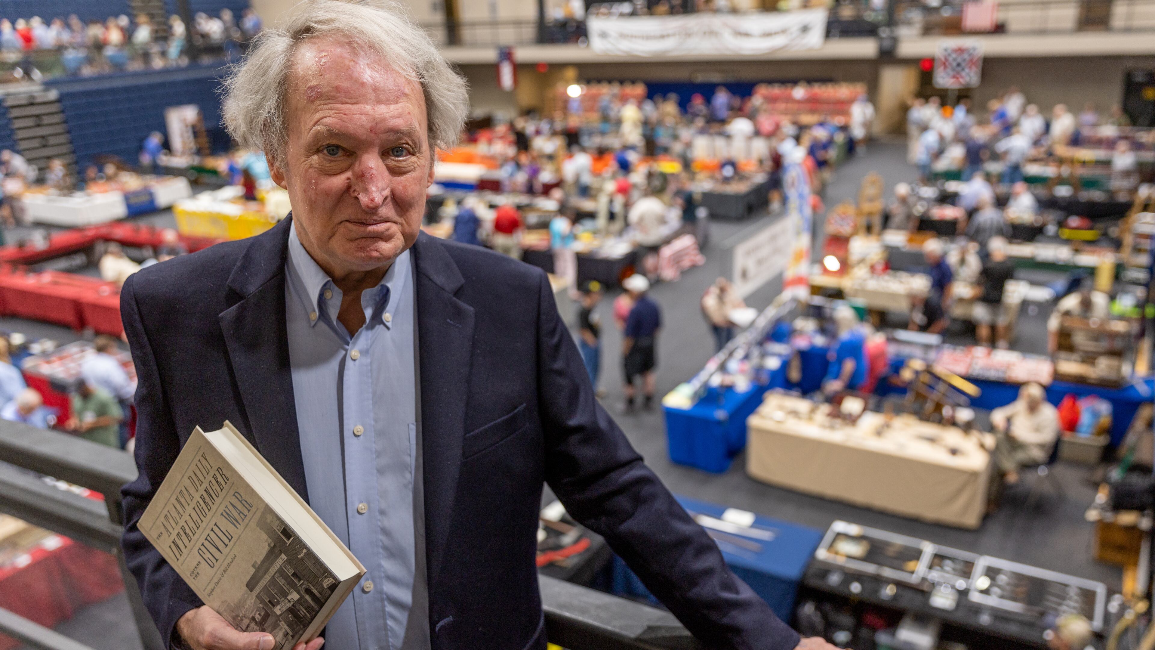 Historian Stephen Davis grew up in Atlanta and attended Margaret Mitchell Elementary School, where a portrait of Vivien Leigh as Scarlett O'Hara stared down at the children in the auditorium. Co-author of "The Atlanta Daily Intelligencer Covers the Civil War," he brought copies of the new book to the recent Civil War Relic Show at the Cobb Civic Center. (Steve Schaefer/steve.schaefer@ajc.com)