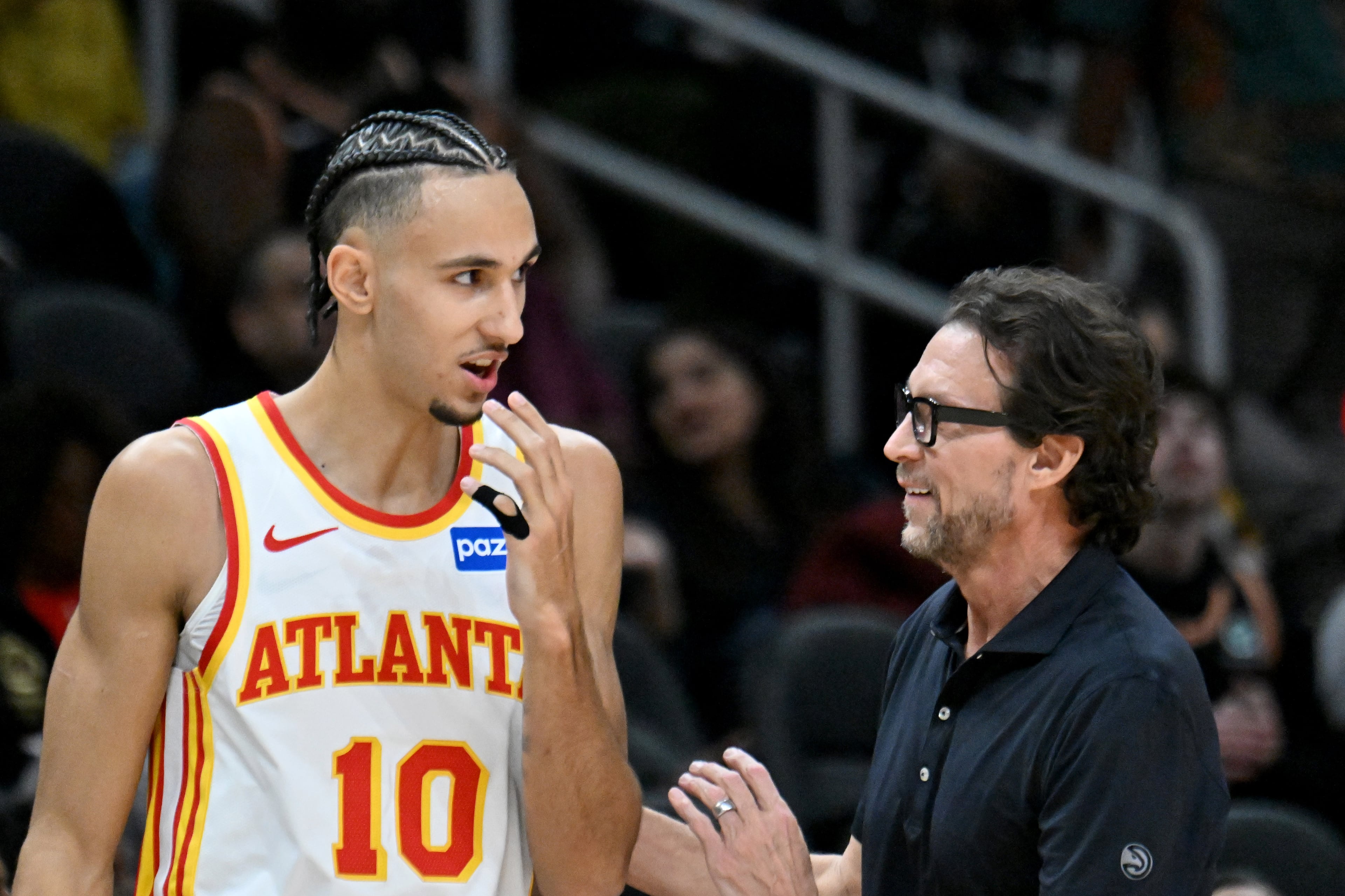 Atlanta Hawks Head Coach Quin Snyder talks to Atlanta Hawks forward Zaccharie Risacher (10) during the first half in an NBA basketball game at State Farm Arena, Wednesday, Jan. 7, 2026, in Atlanta. (Hyosub Shin/AJC)