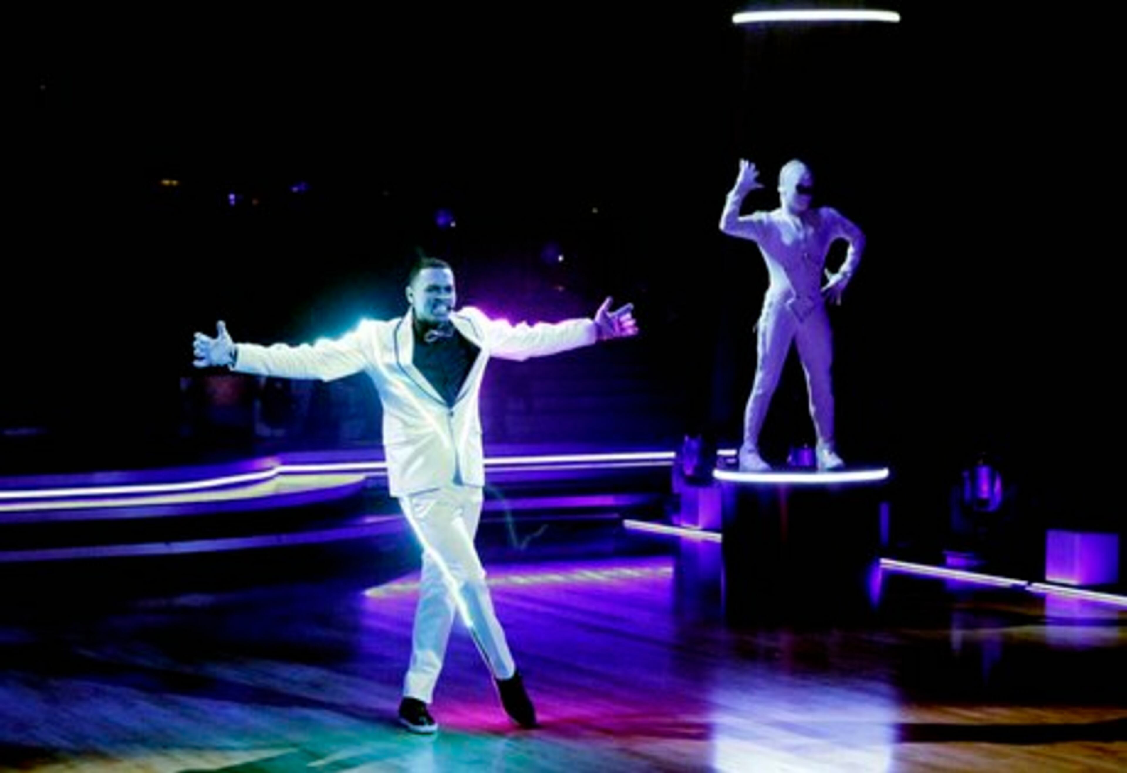 "Dancing with the Stars" featured singer Chris Brown, dressed in all-white suit adorned with LED lighting. Brown performed two songs - and a backflip - in the season's first elimination show. (Spoiler alert)