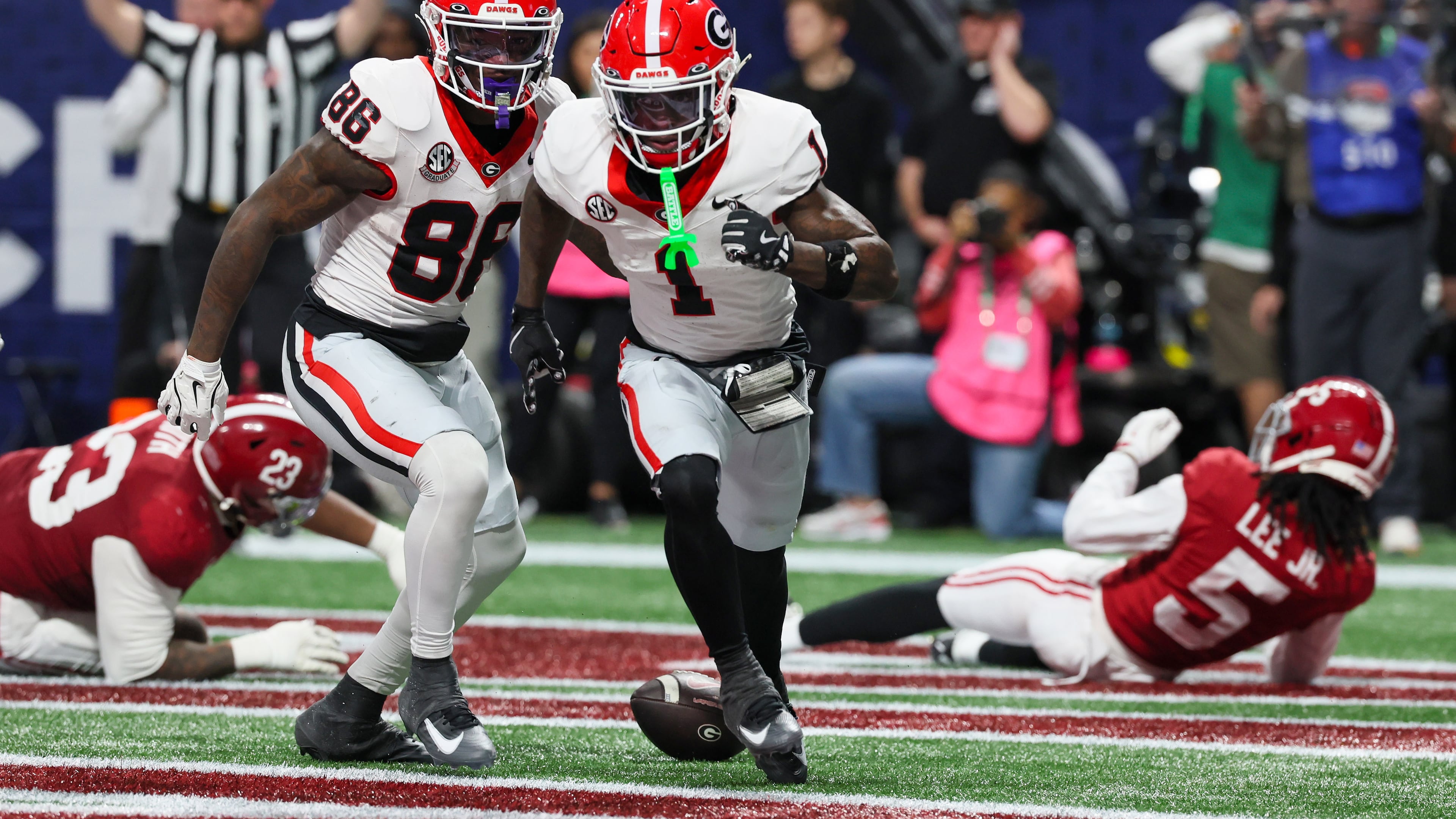 Georgia wide receiver Zachariah Branch (center), shown celebrating after scoring a touchdown against Alabama during the SEC championship game, was nabbed by the Atlanta Falcons with the No. 79 overall pick in the draft. (Jason Getz/AJC 2025)