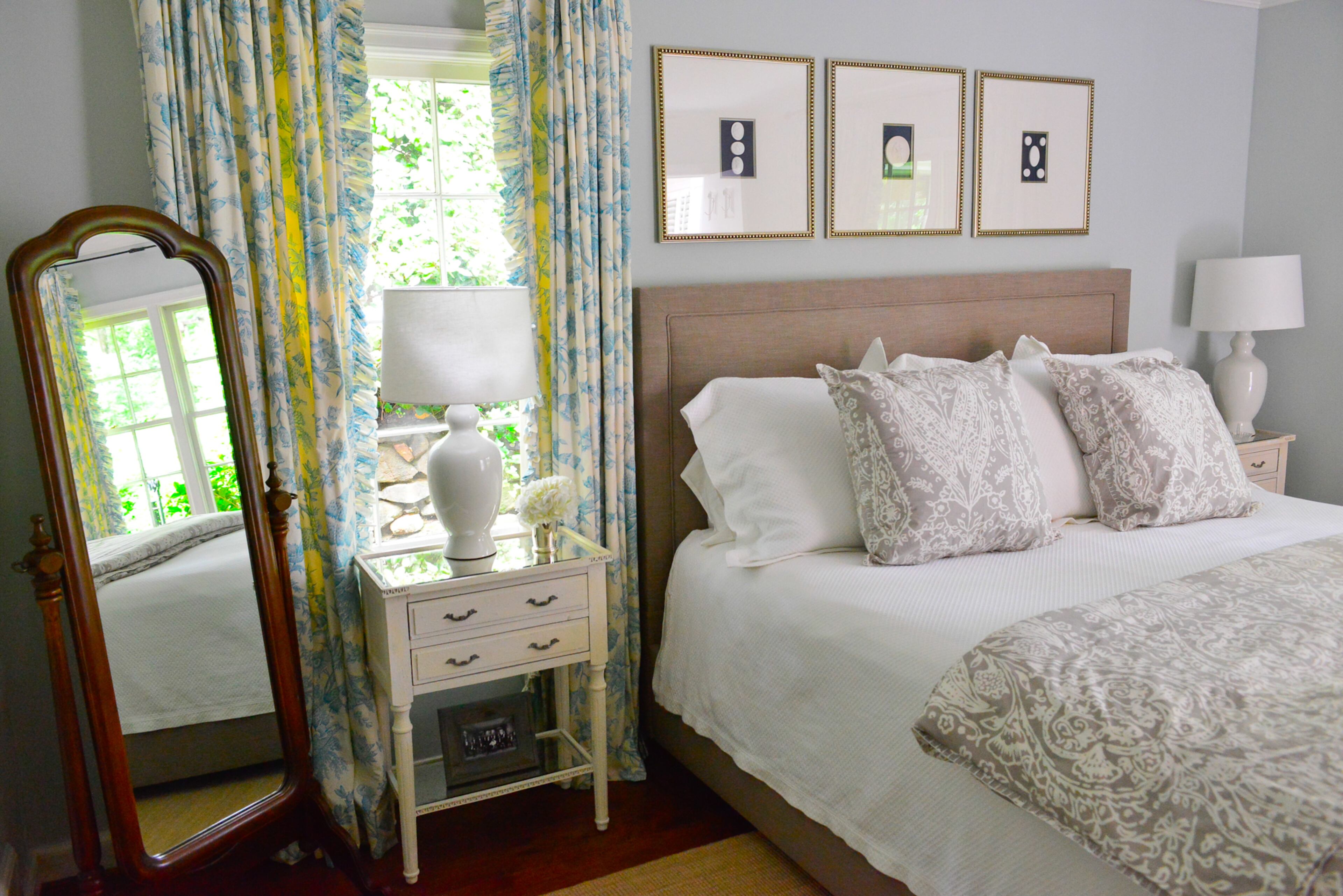 A custom-ordered upholstered bed and bedside tables from Havertys are new items in the master bedroom, which has an antique floor mirror that homeowners TJ and Catherine Callaway received as wedding gift. Framed intaglios purchased from a private antique dealer in Atlanta are above the bed, which has bedding from Erika Reade. All the draperies are custom made in the home.
