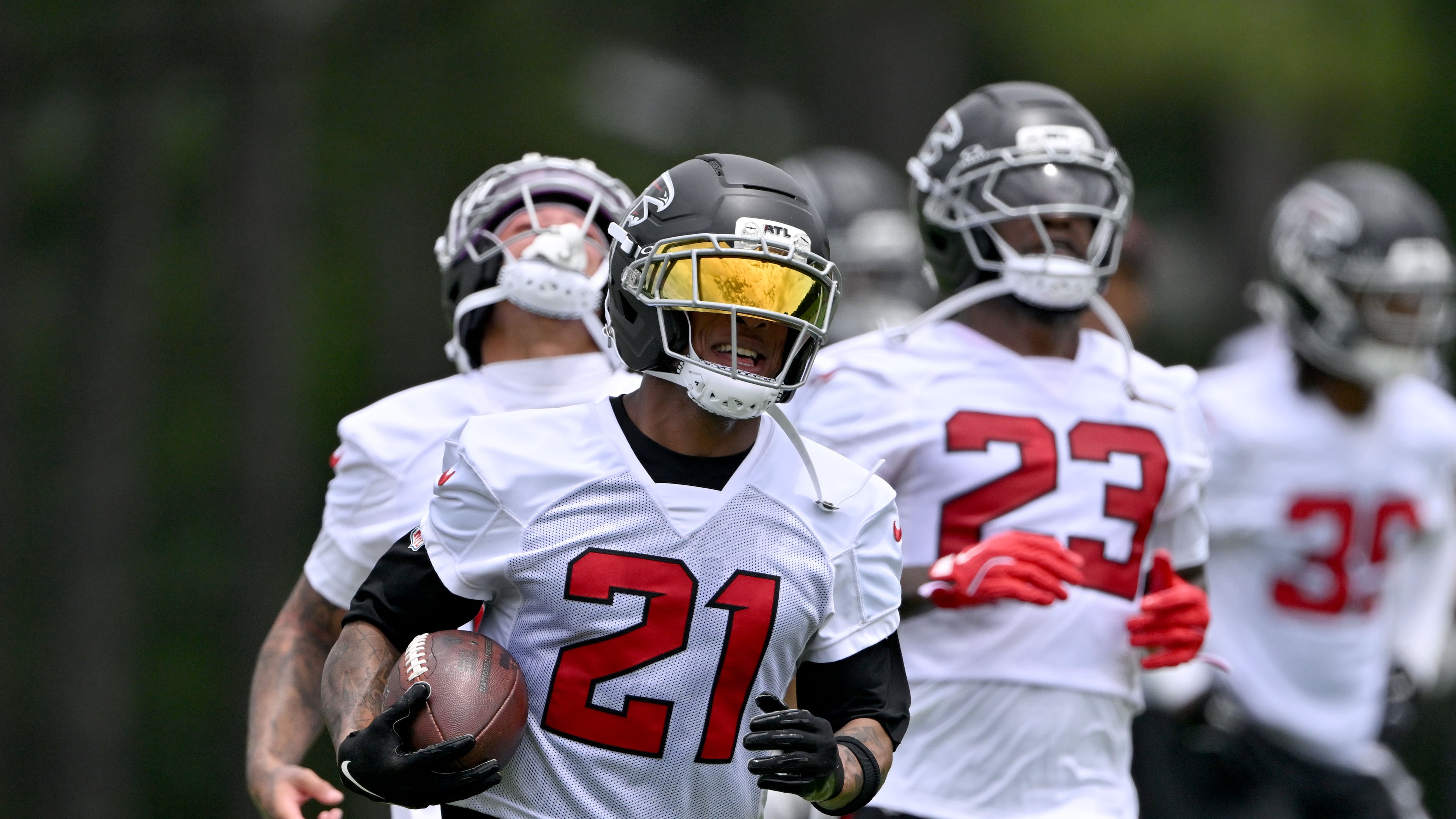 Falcons cornerback Mike Hughes (center) — pictured during OTAs in late May — is entering his ninth season in the NFL. He missed two games with Atlanta because of a neck injury in 2024 and five games with neck and ankle injuries last season. (Hyosub Shin/AJC)