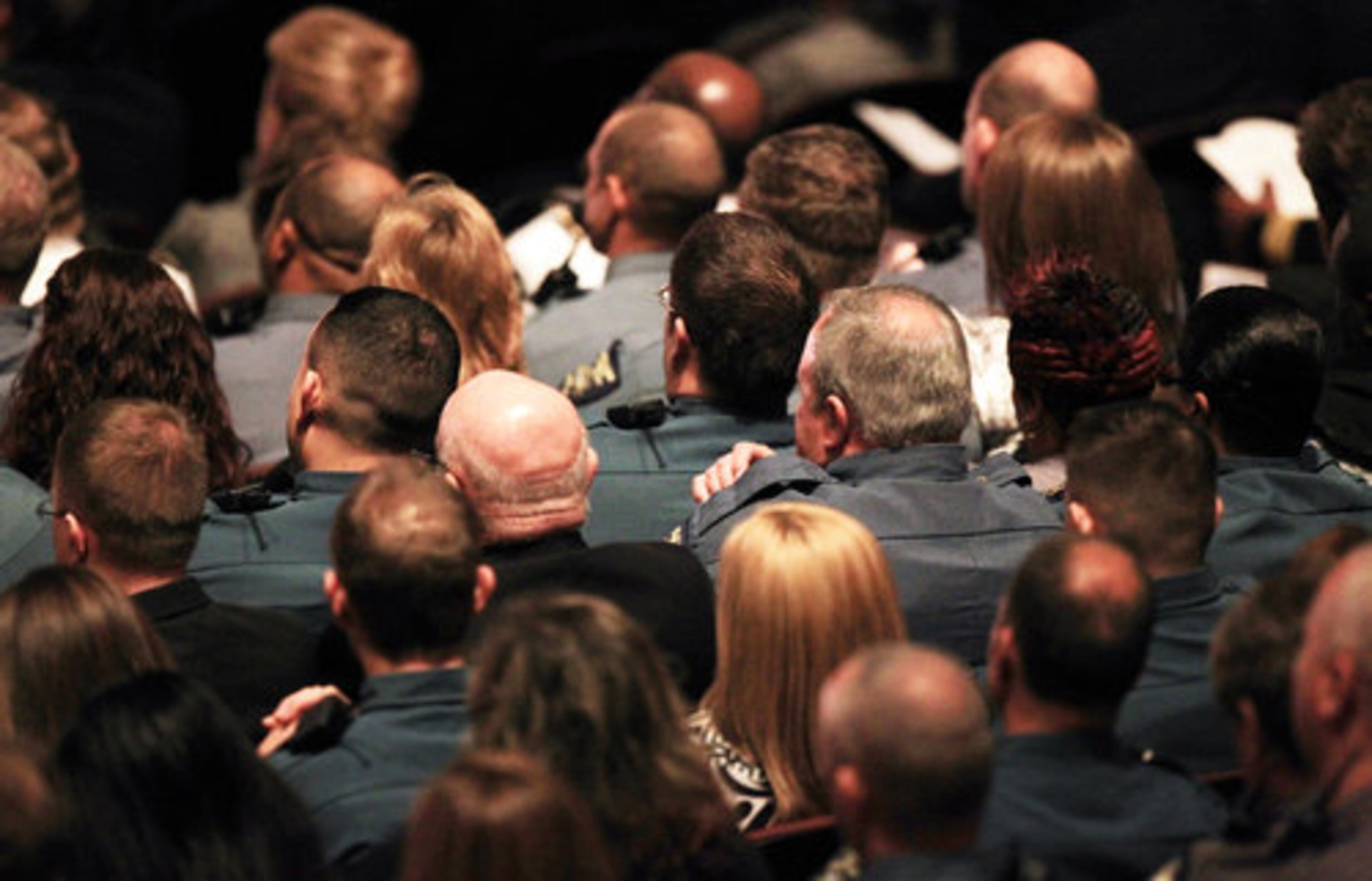 Dozens of Athens-Clarke County police officers sit together for the memorial service of slain Athens Senior Officer Elmer "Buddy" Christian at the Classic Center Theatre in Athens on Sunday, March 27, 2011.