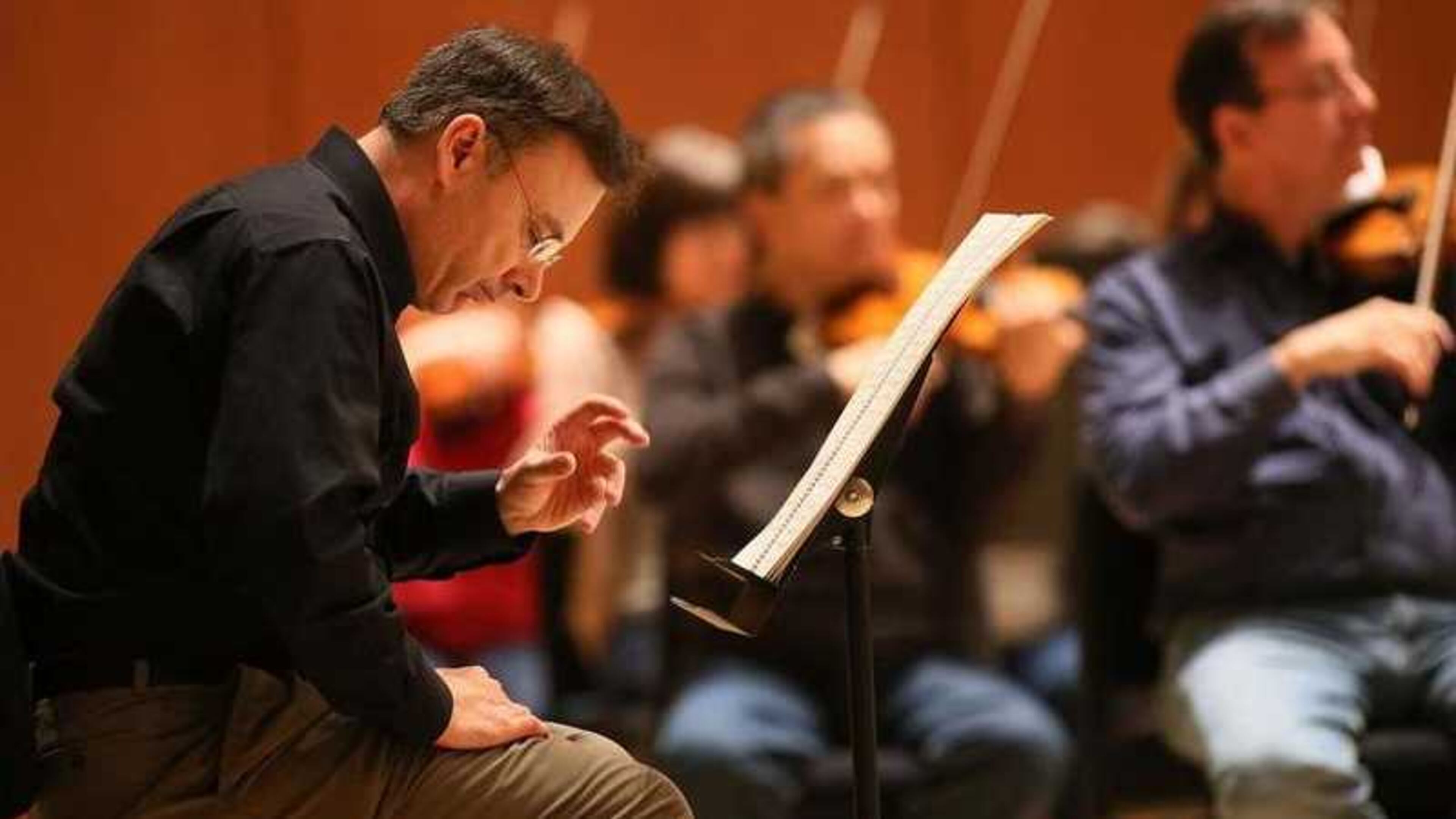 Atlanta composer Richard Prior listens intently as Atlanta Symphony Orchestra music director Robert Spano conducts the first rehearsal of Prior’s Symphony No. 3 in Symphony Hall in this AJC file photo.