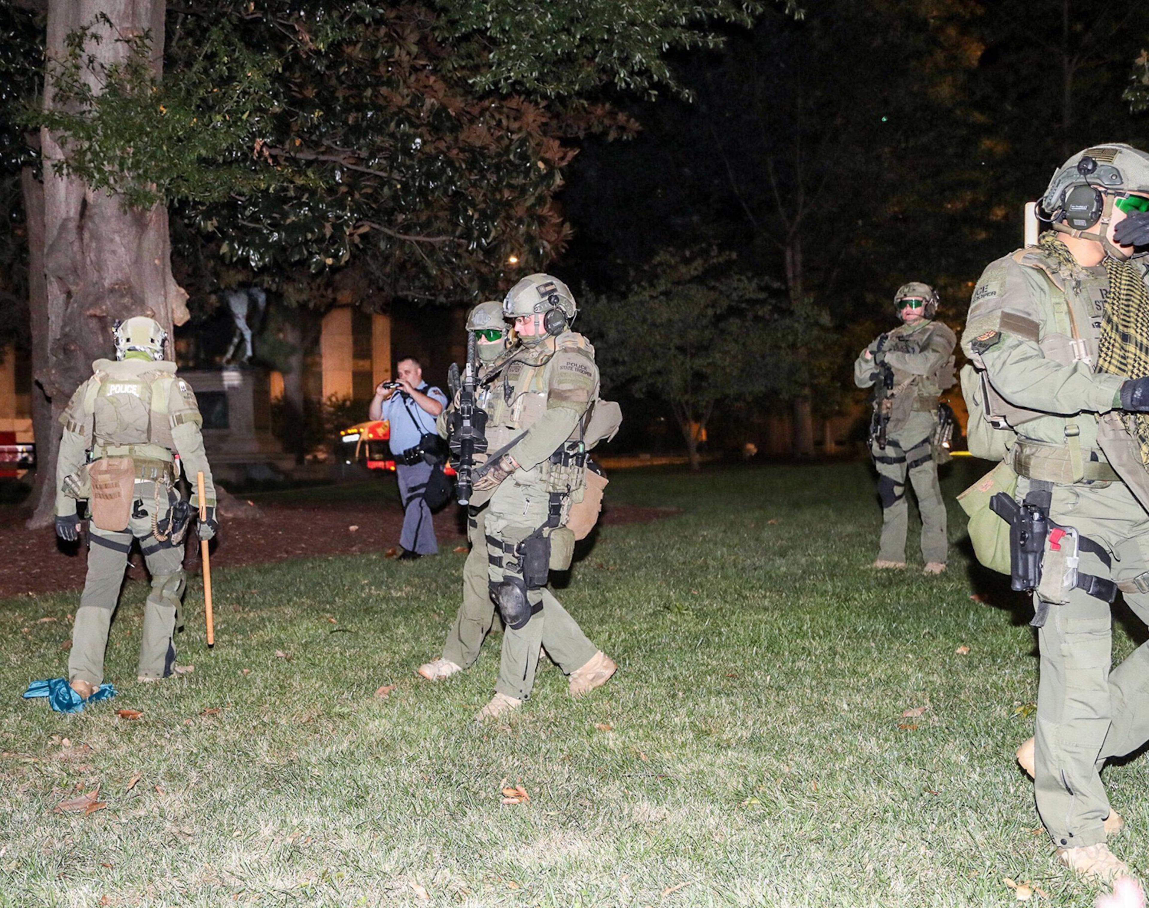 Georgia State Troopers confront demonstrators while guarding the State Capitol Building in Atlanta on Wednesday, Aug. 24, 2020. (Alyssa Pointer/Alyssa.Pointer@ajc.com)