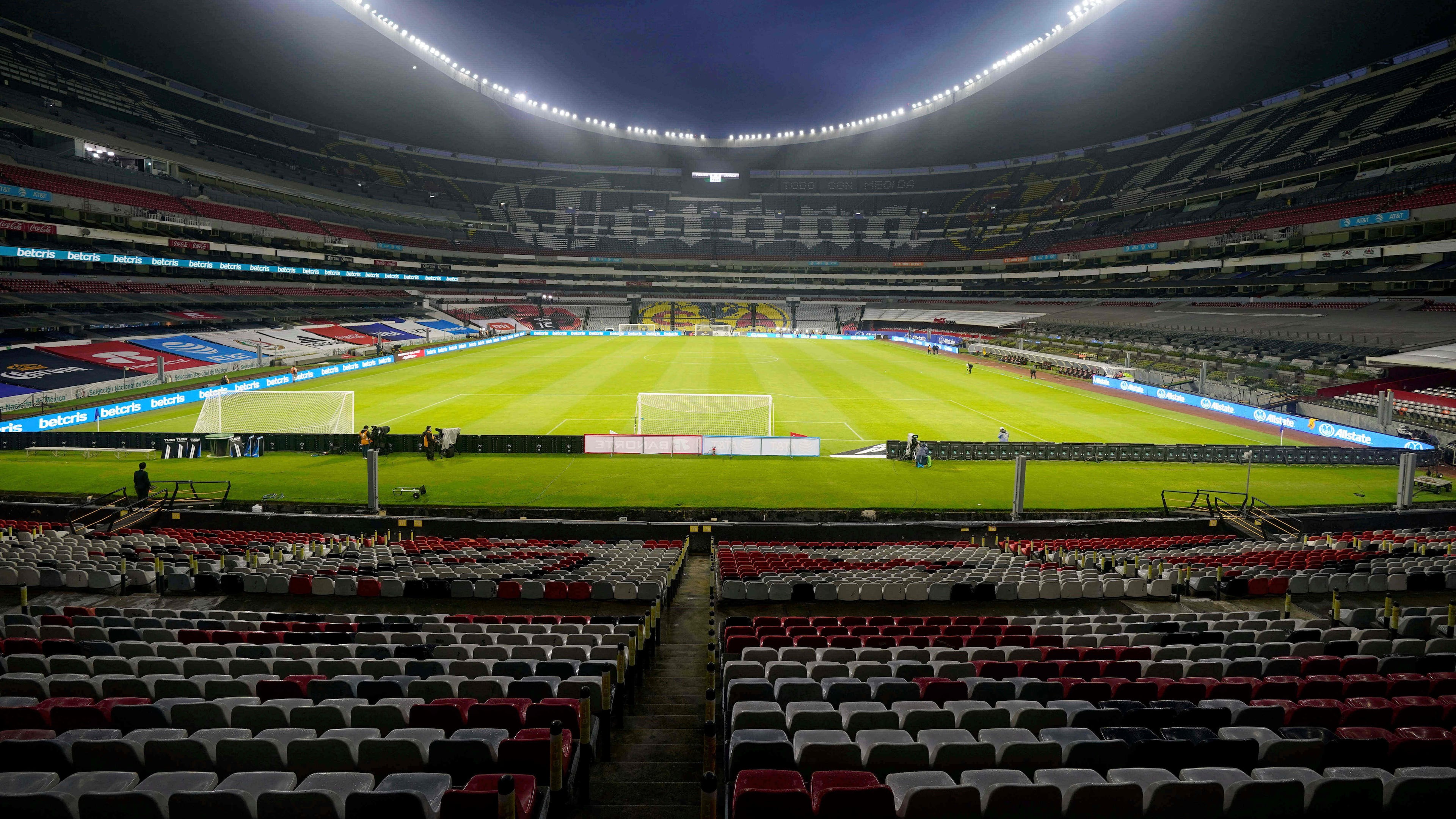 FILE - The stands of the Azteca stadium are seen empty of fans prior a World Cup Qatar 2022 qualifying soccer match between Mexico and Jamaica, in Mexico City, Thursday, Sept. 2, 2021. (AP Photo/Eduardo Verdugo, File)