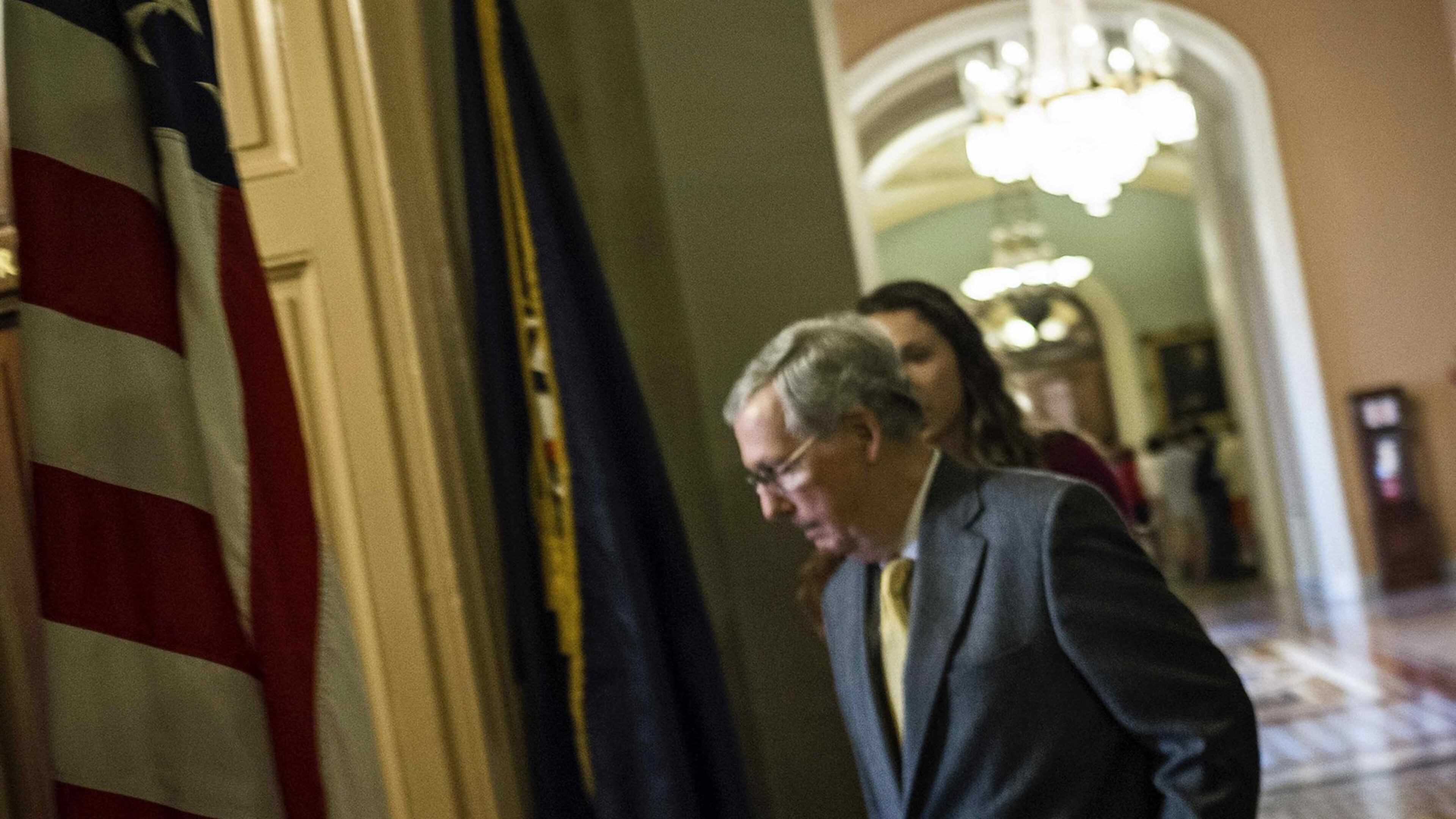 Senate Majority Leader Mitch McConnell, R-Ky., walks into his Capitol office on Tuesday. The Senate passed the Medicare bill late that night. It was the product of extraordinary cooperation between House Speaker John Boehner and House Democratic leader Nancy Pelosi. It received broad bipartisan support in both houses. REUTERS/James Lawler Duggan