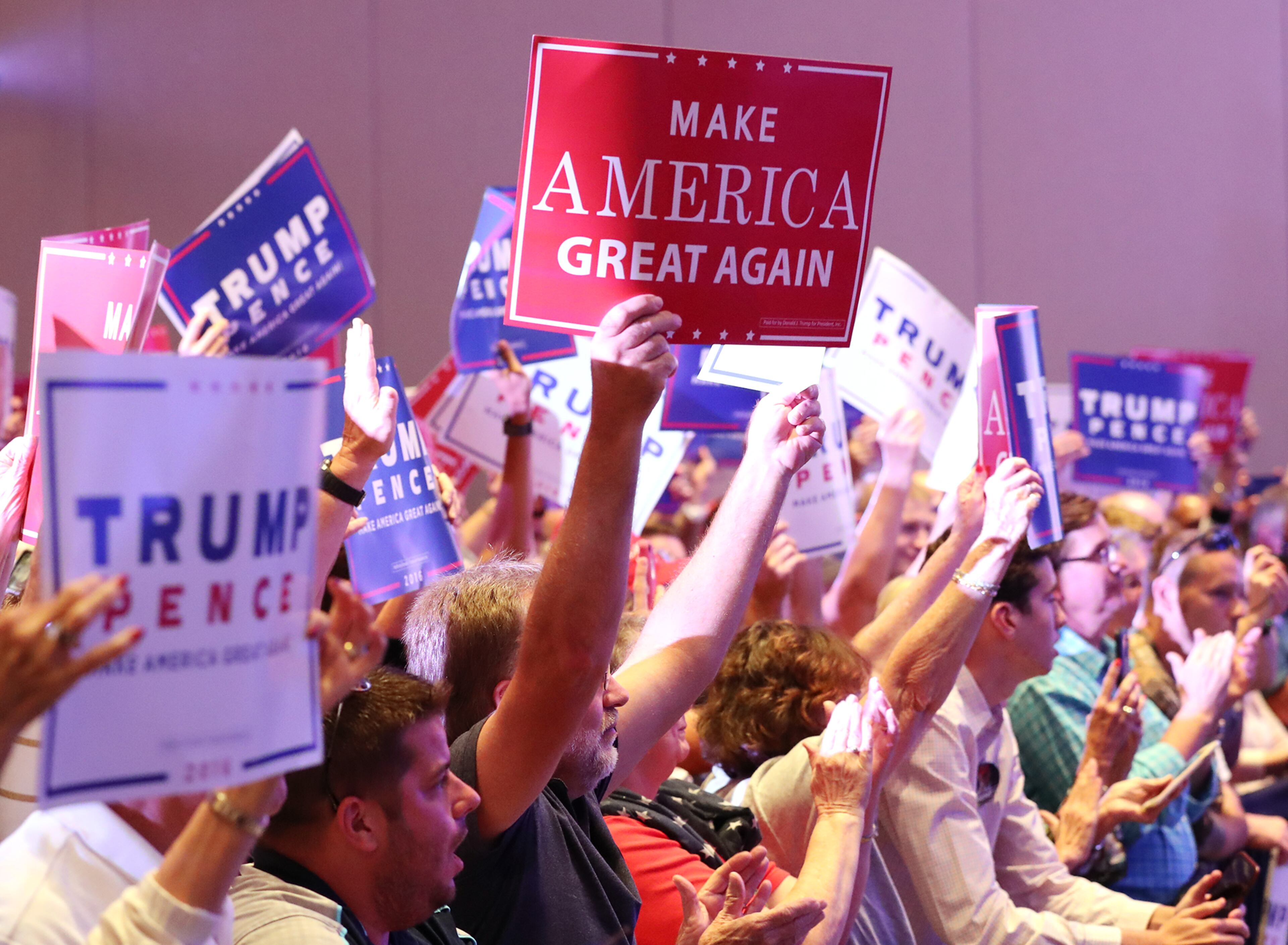 Supporters cheer as Republican vice presidential nominee Mike Pence speaks in Marietta on Monday. Curtis Compton /ccompton@ajc.com