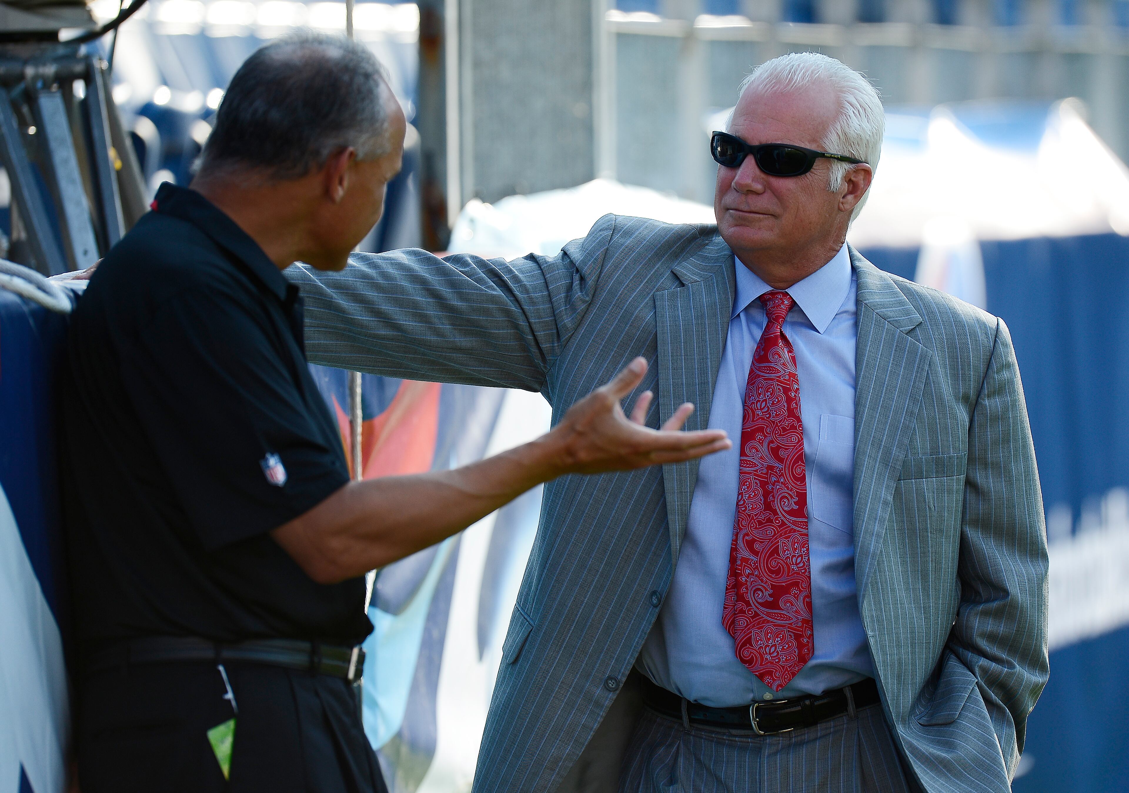 Atlanta Falcons head coach Mike Smith, right, speaks with an official before the first half of an NFL preseason football game against the Tennessee Titans, Saturday, Aug. 24, 2013, in Nashville, Tenn. (AP Photo/Mark Zaleski)