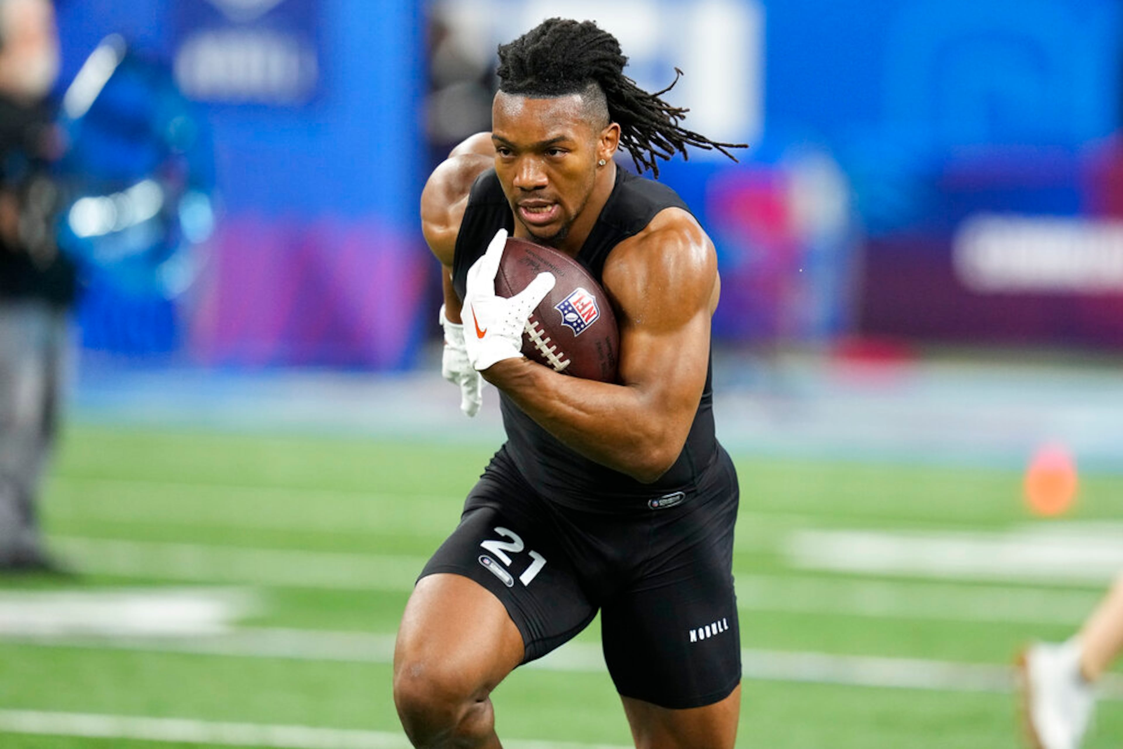 Texas running back Bijan Robinson runs a drill at the NFL football scouting combine in Indianapolis, Sunday, March 5, 2023. (AP Photo/Darron Cummings)