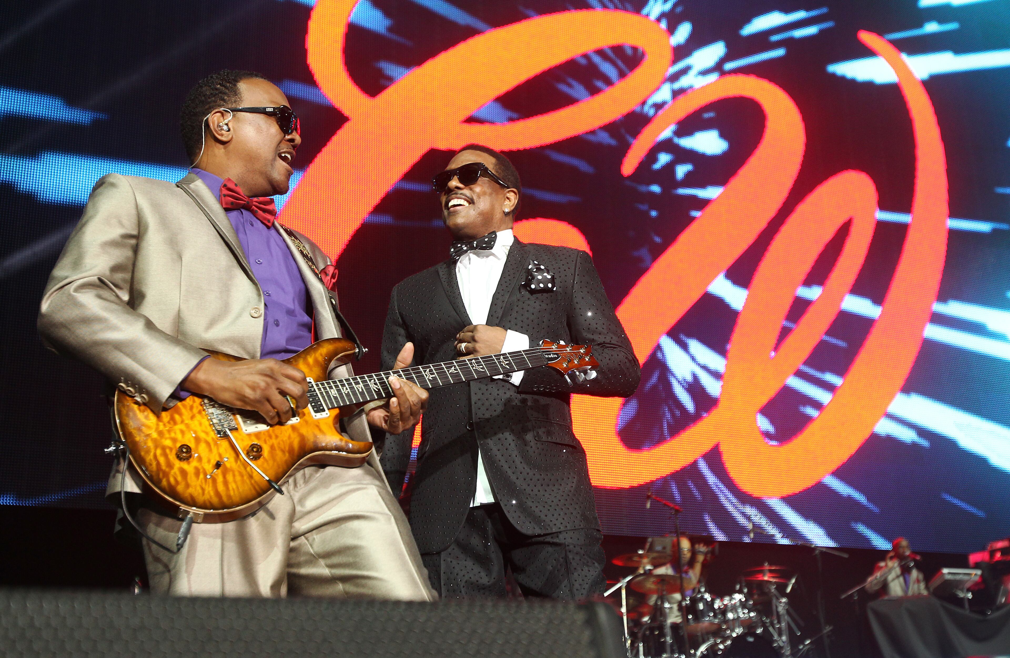 Charlie Wilson center performs on Day 2 of the 2013 Essence Music Festival at the Mercedes-Benz Superdome on Saturday, July 6, 2013 in New Orleans. (Photo by Donald Traill/Invision/AP)