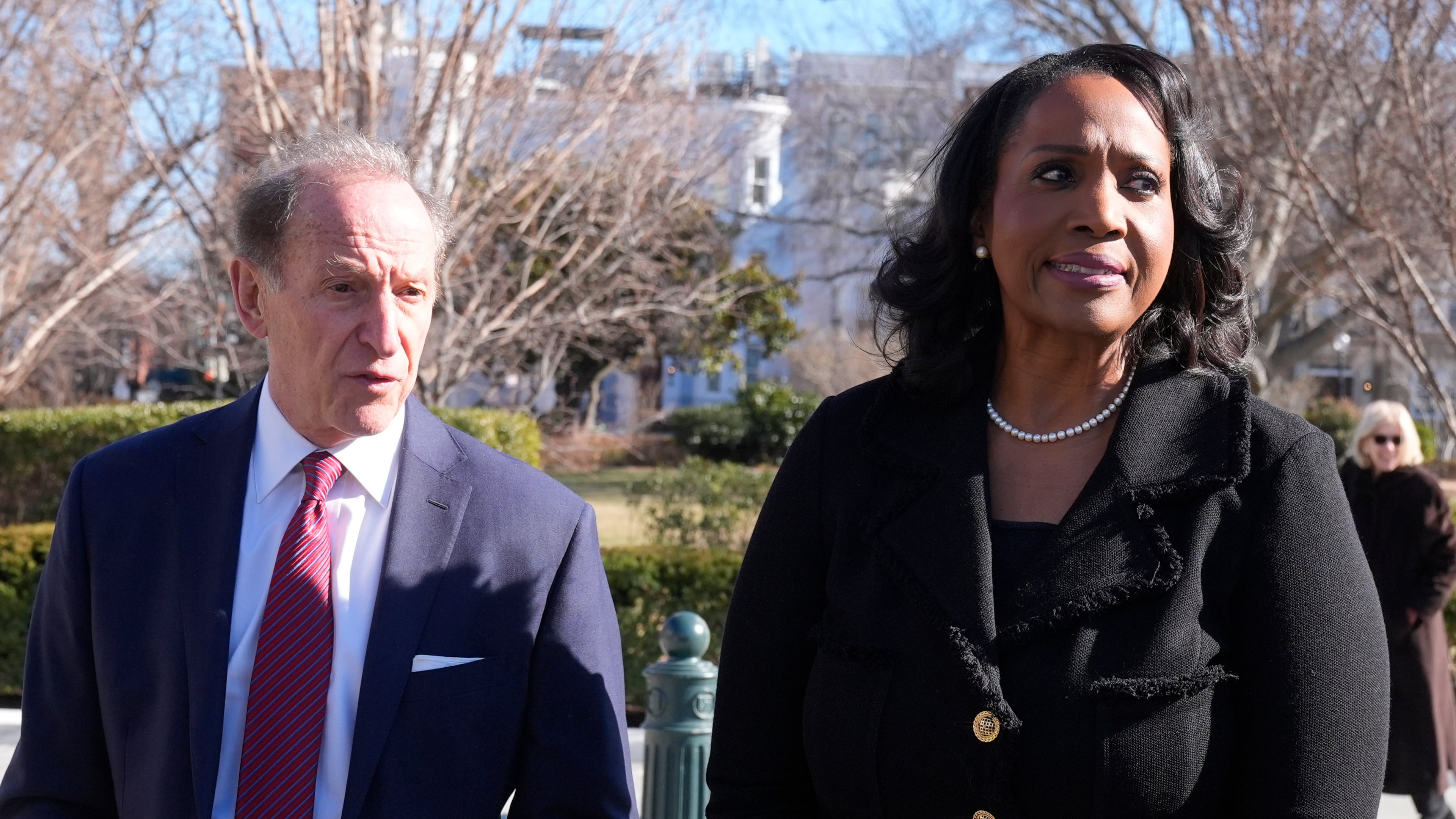 Federal Reserve governor Lisa Cook and attorney Abbe Lowell leave the Supreme Court in Washington, Wednesday, Jan. 21, 2026. (AP Photo/Mark Schiefelbein)