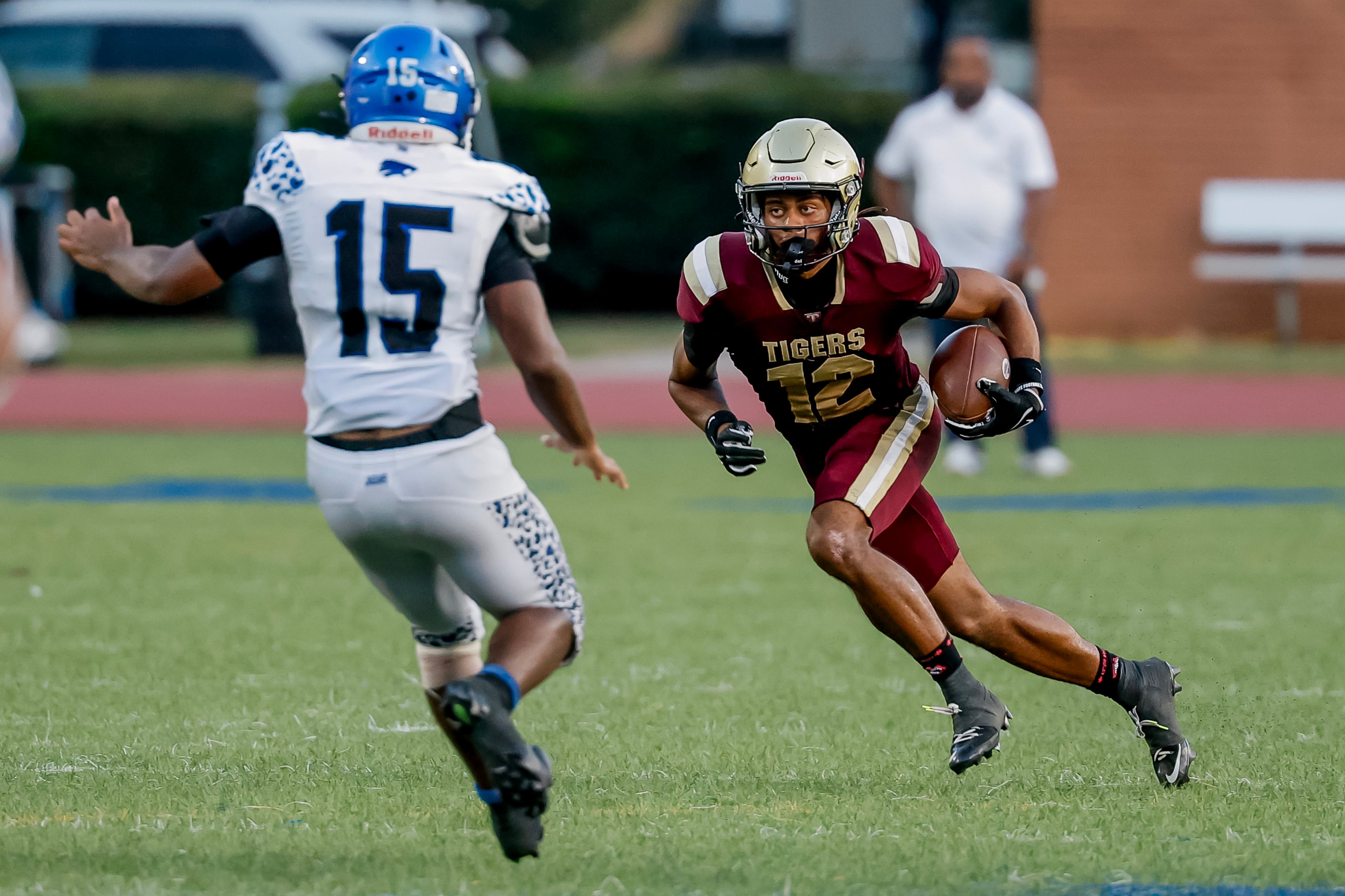 Stephenson long snapper Kaiden Gooden (left) defends a punt return by Tucker's Jayden Joyner on Friday, Sept. 4, 2026, in Clarkston. (Erik S. Lesser for the AJC)