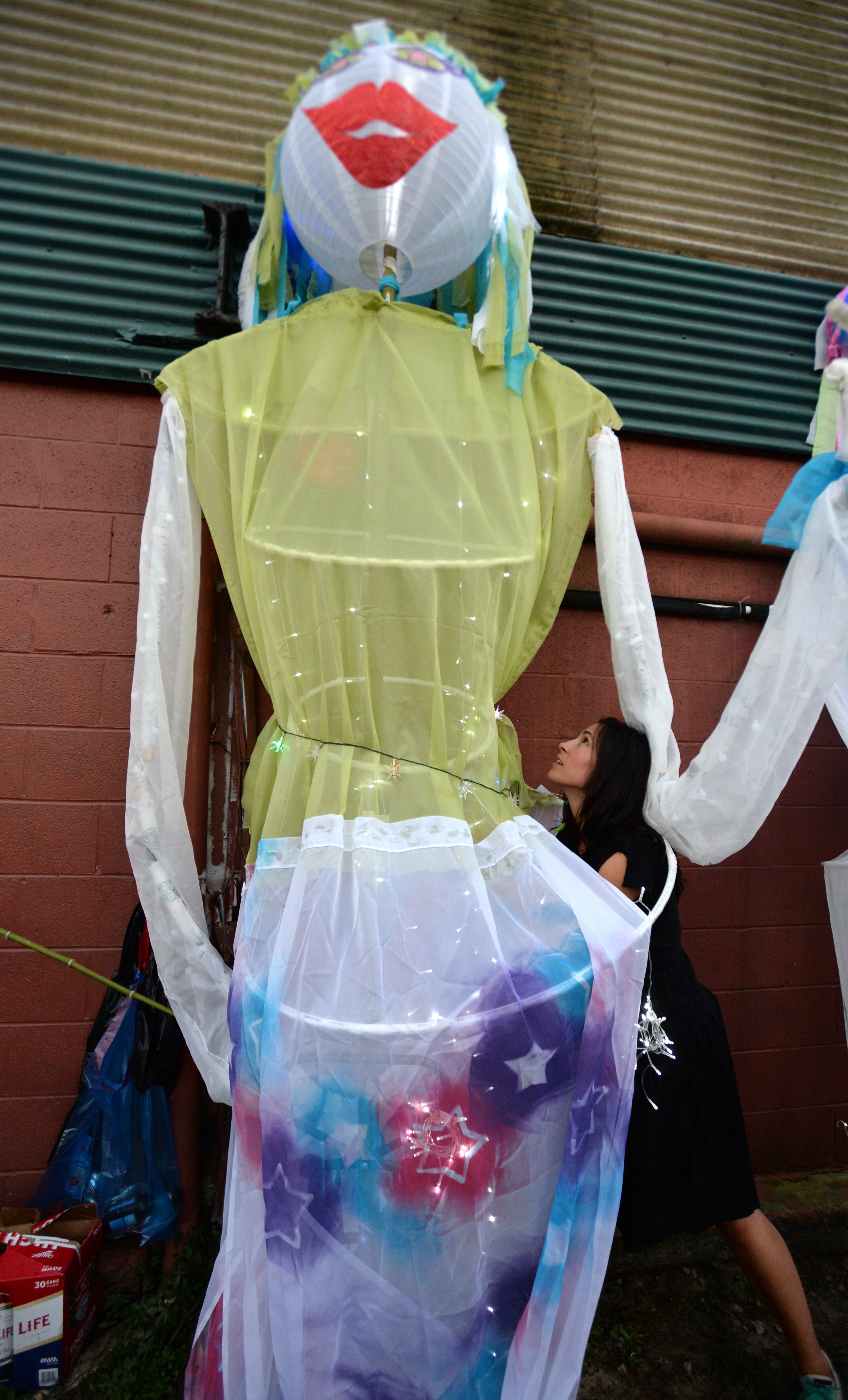 Bevery Beyer prepares one of Star Sisters lantern during a tailgate line-up at Irwin Street and Krog Street before the 2013 Atlanta BeltLine Lantern Parade on Sept. 7, 2013.