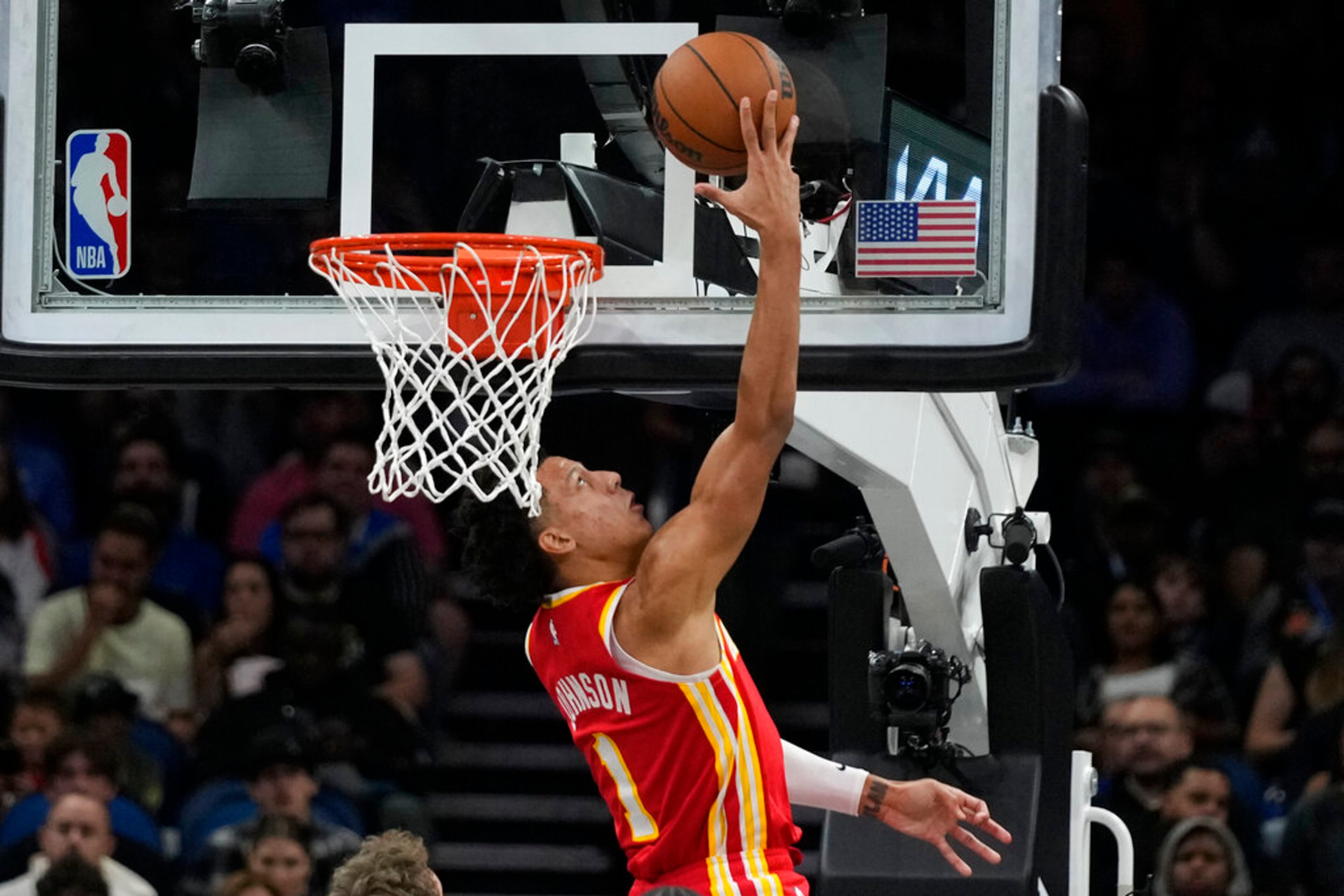 Atlanta Hawks' Jalen Johnson makes a reverse layup against the Orlando Magic during the second half of an NBA basketball game, Wednesday, Dec. 14, 2022, in Orlando, Fla. (AP Photo/John Raoux)